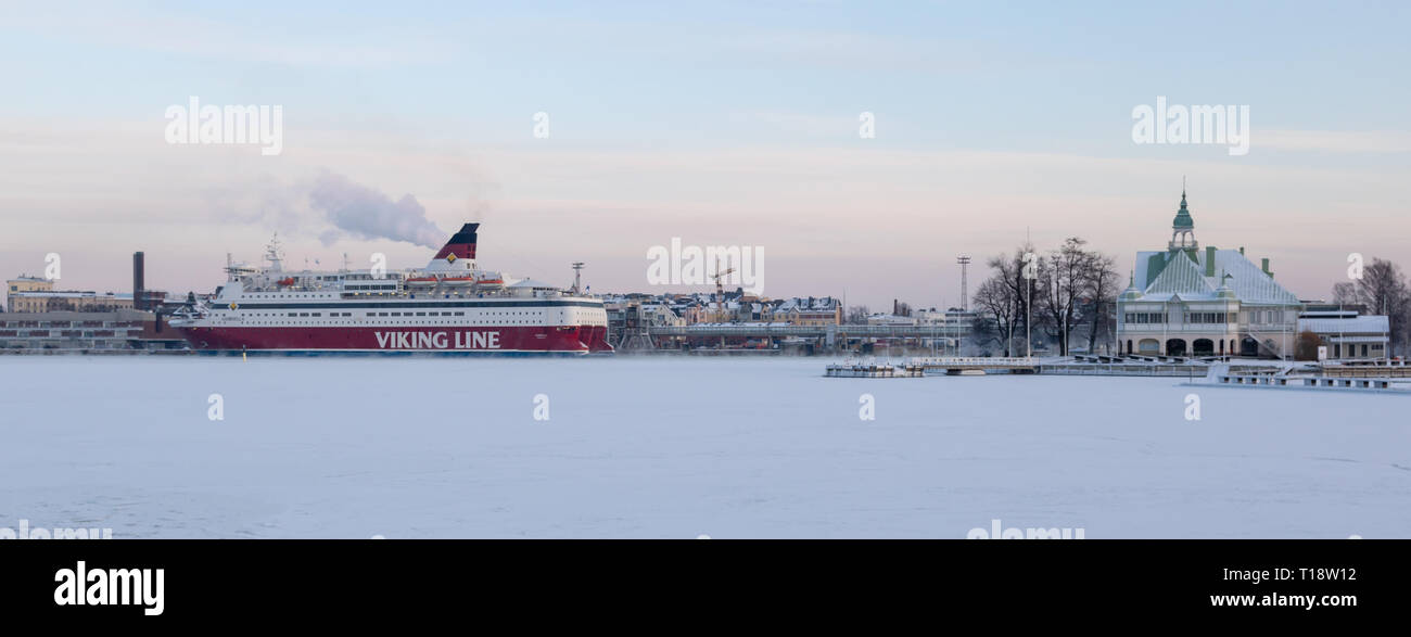 HELSINKI, FINLAND - January 08, 2015: Viking Line passenger cruise ship departing the port of Helsinki in winter Stock Photo