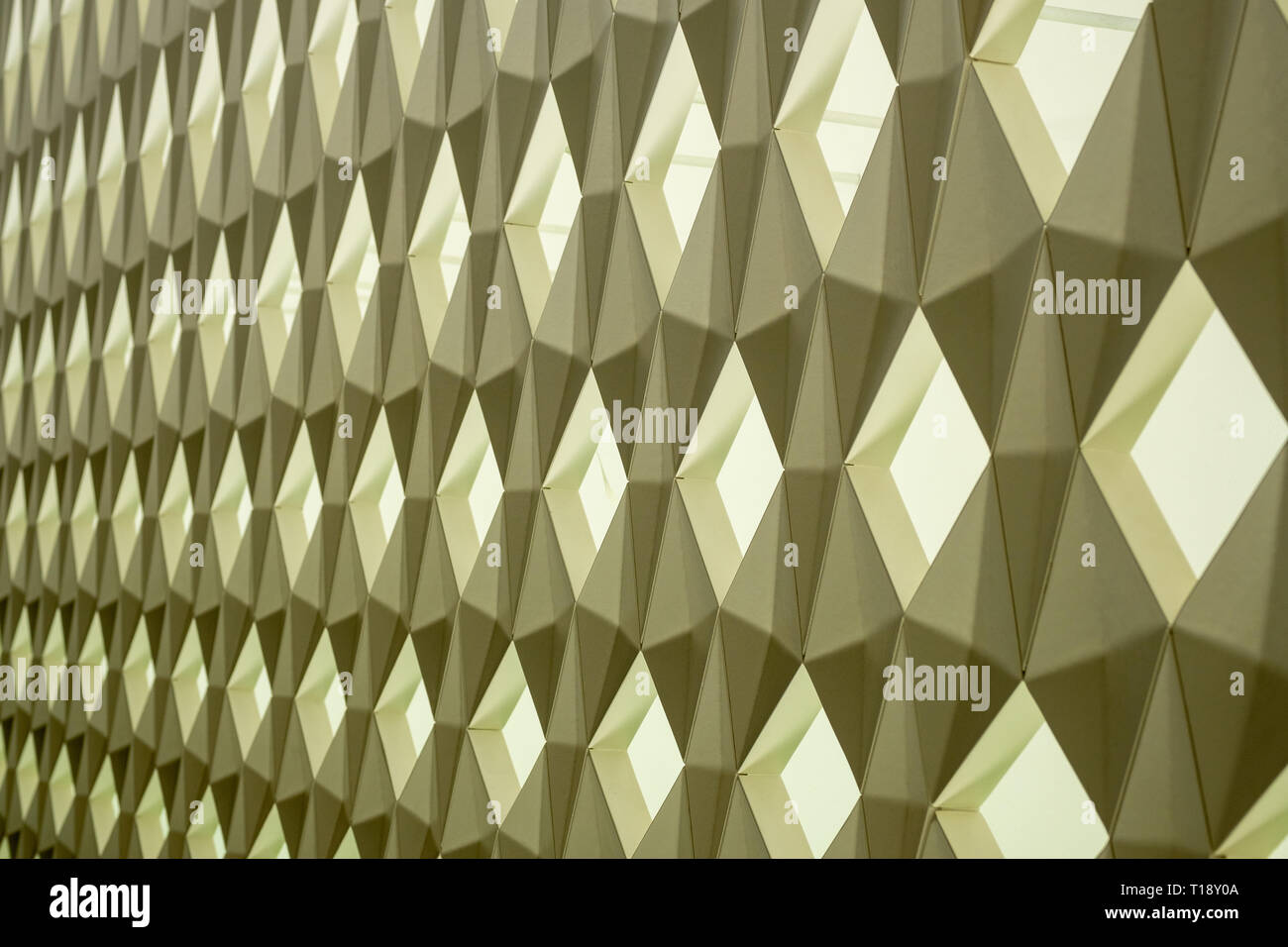 Geometric wall pattern with green background lights Stock Photo
