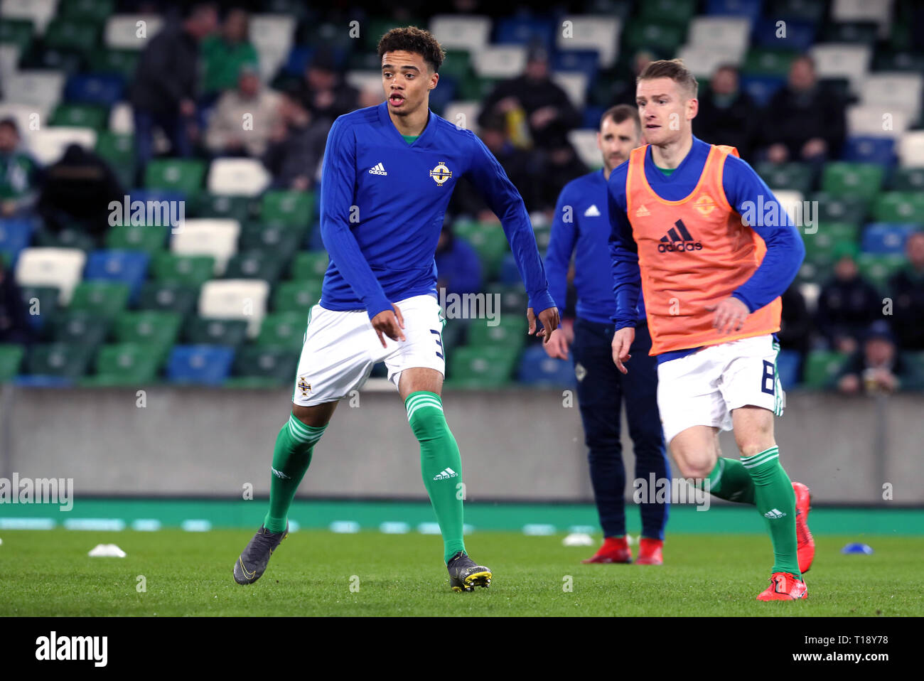 Northern Ireland's Jamal Lewis (left) and Steven Davis warm up before the UEFA Euro 2020 Qualifying, Group C match at Windsor Park, Belfast. Stock Photo