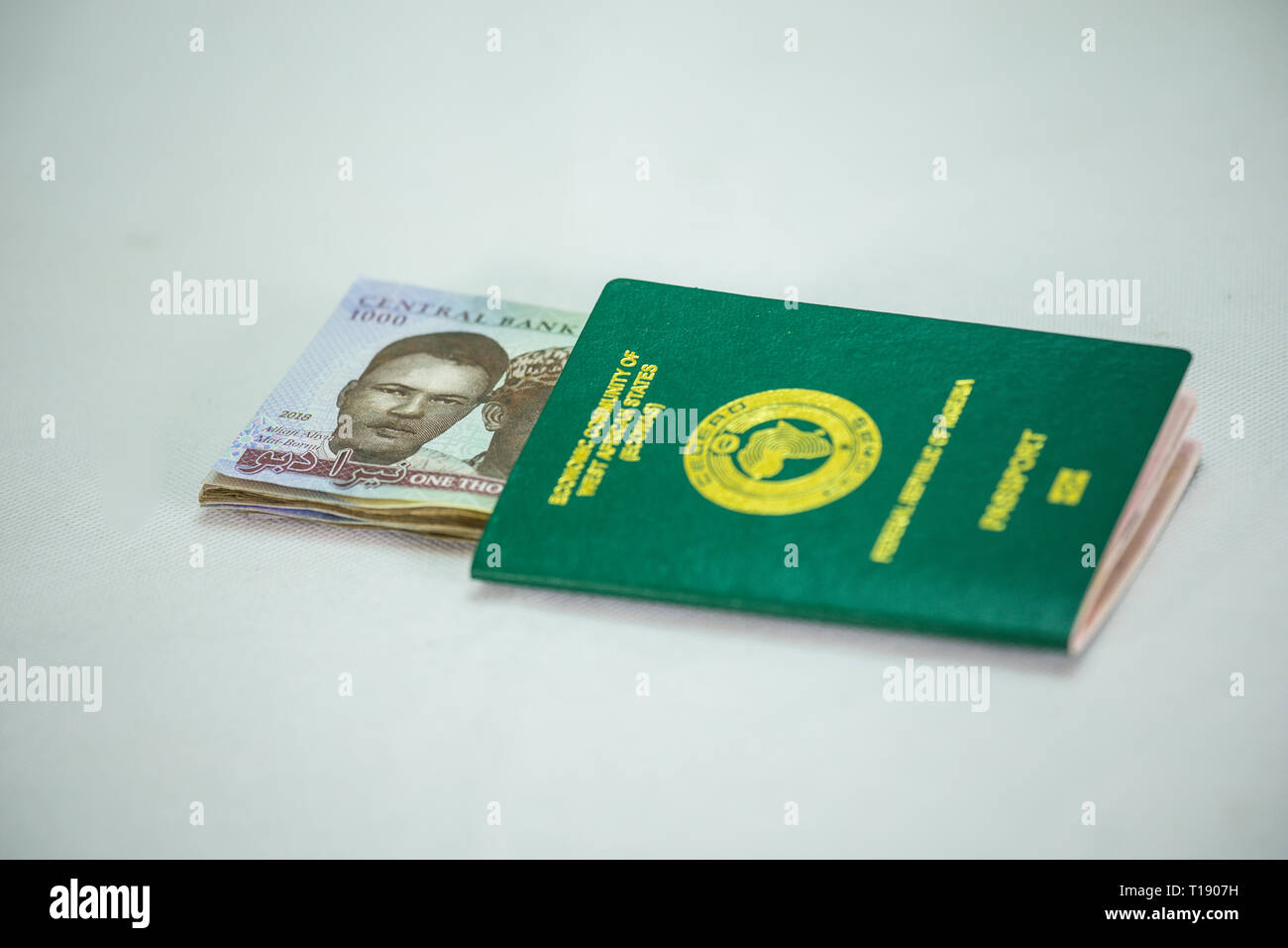 Ecowas and International Passport with N1000 Local currency notes Stock Photo