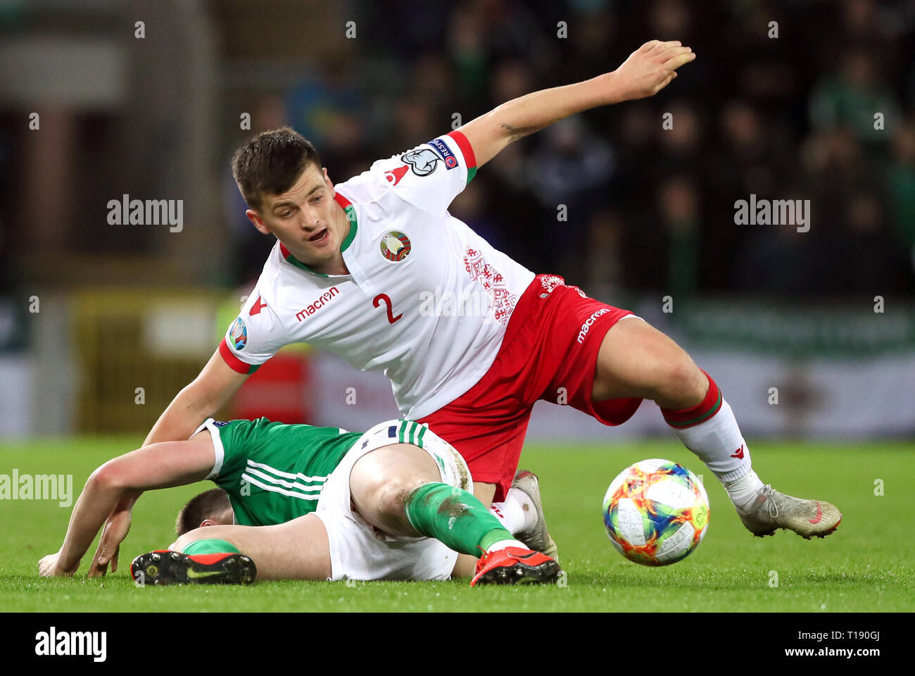 Belarus' Stanislav Dragun (right) and Northern Ireland's Paddy McNair battle for the ball during the UEFA Euro 2020 Qualifying, Group C match at Windsor Park, Belfast. Stock Photo