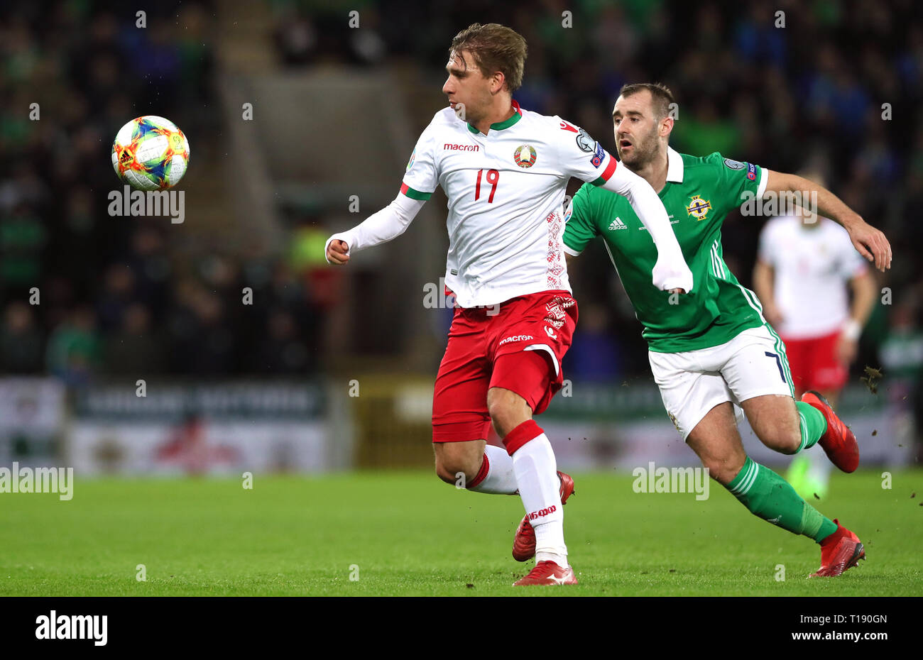 Belarus' Maksim Valadzko (left) and Northern Ireland's Niall McGinn battle for the ball during the UEFA Euro 2020 Qualifying, Group C match at Windsor Park, Belfast. Stock Photo