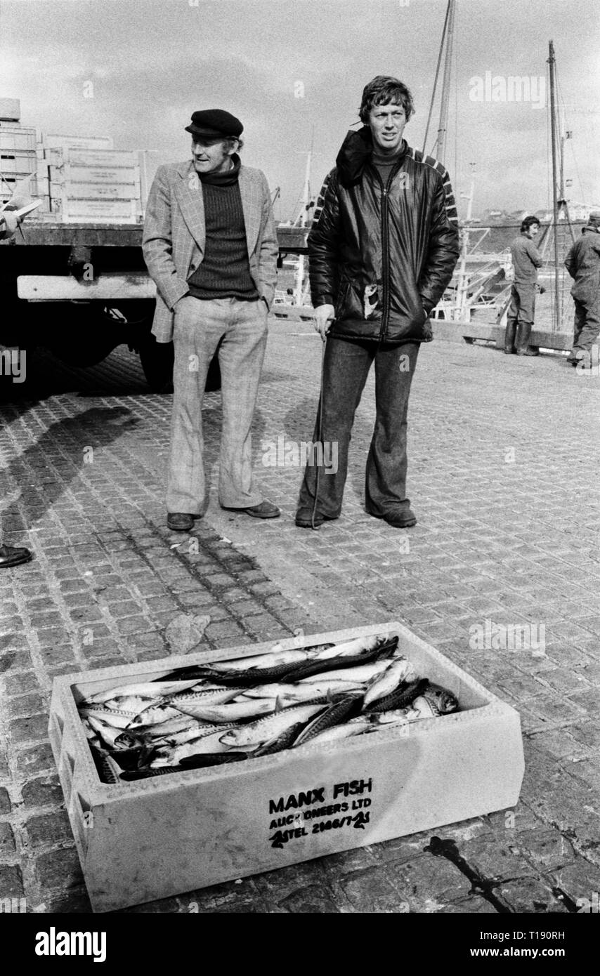 Isle of Man, Douglas, 1970s. Fishing industry, fisherman fishing boats have just unloaded in harbour dock. Manx fresh fish for sale to local people. 1978 HOMER SYKES Stock Photo