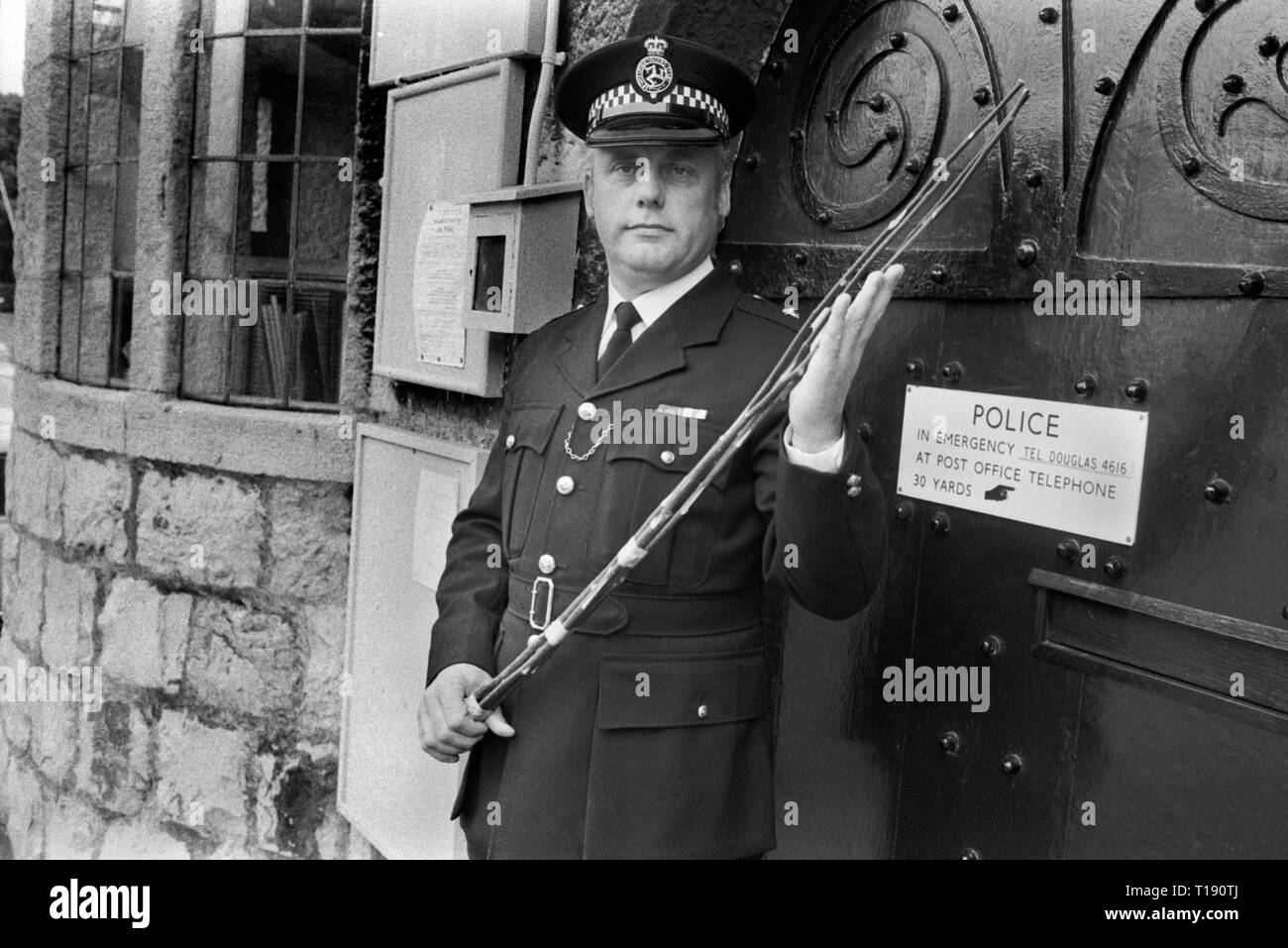 The birch rod, corporal punishment Law and Order the Isle of Man 1970s . Superintendent Alan Killip, the Isle of Man's highest ranking police officer holding a Manx birch rod at Castle Rushen, Castletown. The birching  was still used for corporal punishment on the Isle of Man during the 1970s. Administered by the police to petty offenders. 1978 HOMER SYKES Stock Photo