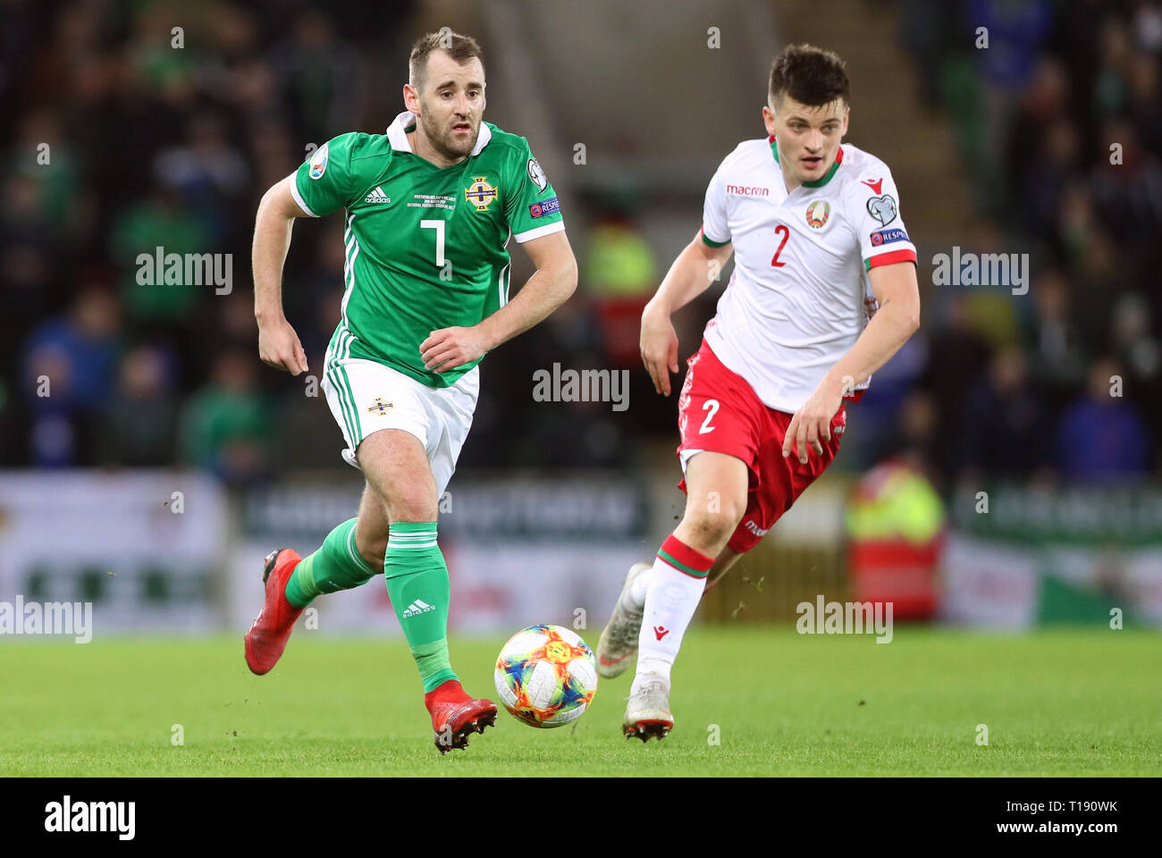 Northern Ireland's Niall McGinn (left) and Belarus' Stanislav Dragun battle for the ball during the UEFA Euro 2020 Qualifying, Group C match at Windsor Park, Belfast. Stock Photo