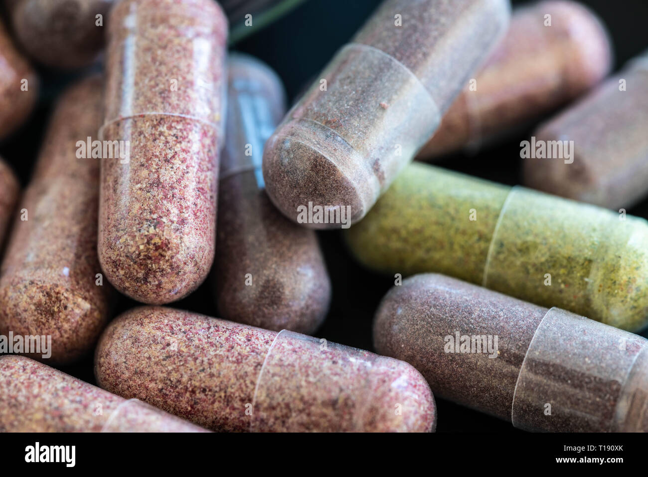 Colourful capsules of fruit and veggies supplements Stock Photo