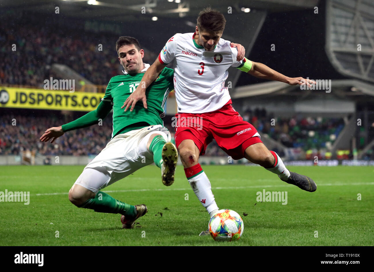 Northern Ireland's Kyle Lafferty (left) and Belarus' Aleksandr Martynovich battle for the ball during the UEFA Euro 2020 Qualifying, Group C match at Windsor Park, Belfast. Stock Photo
