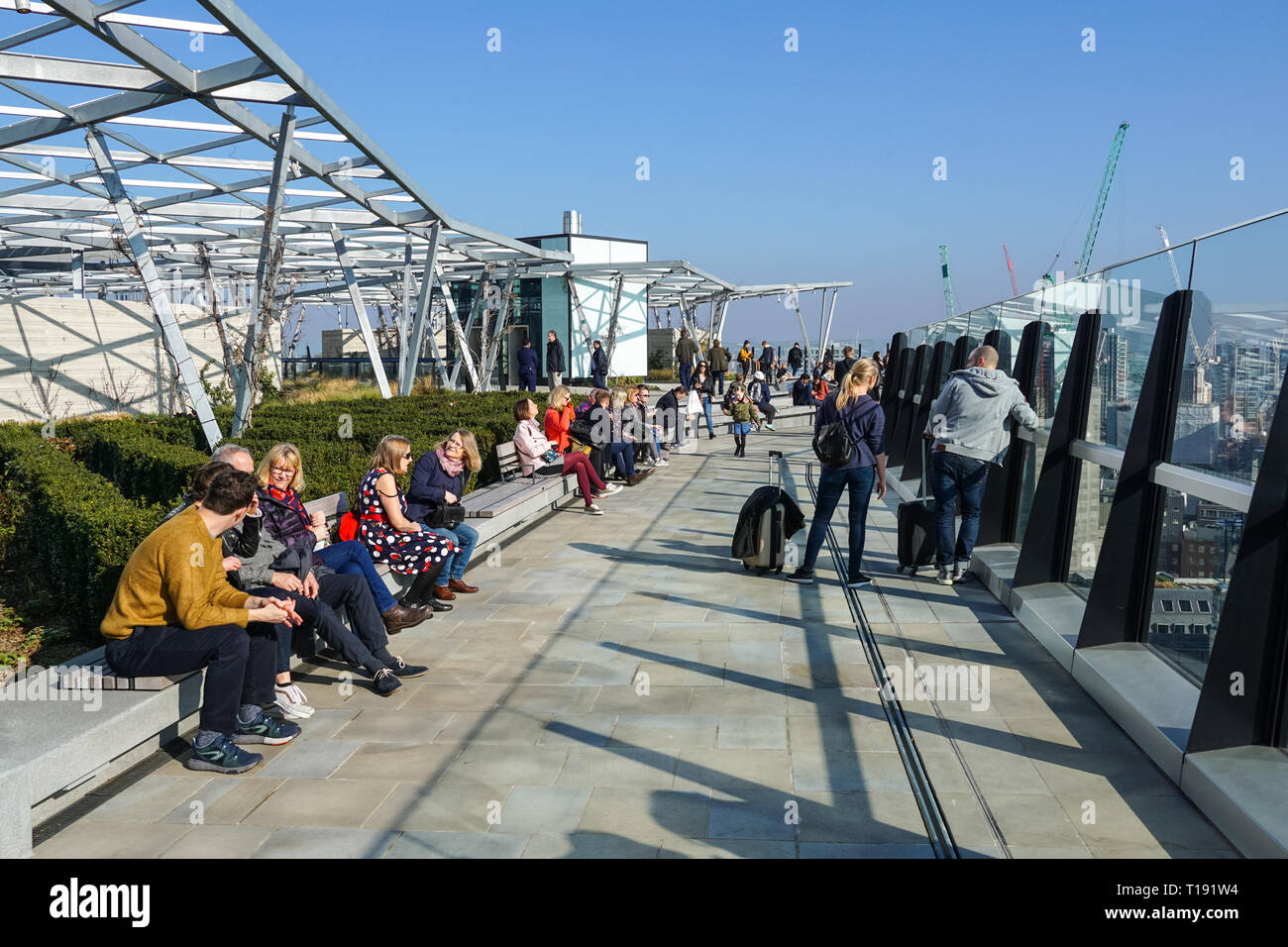 People enjoy sunny day on roof garden on top of Fen Court at 120 Fenchurch Street, London England United Kingdom UK Stock Photo