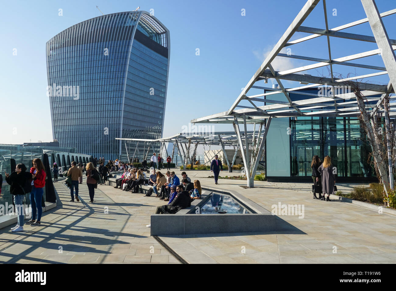 People enjoy sunny day on roof garden on top of Fen Court at 120 Fenchurch Street, London England United Kingdom UK Stock Photo