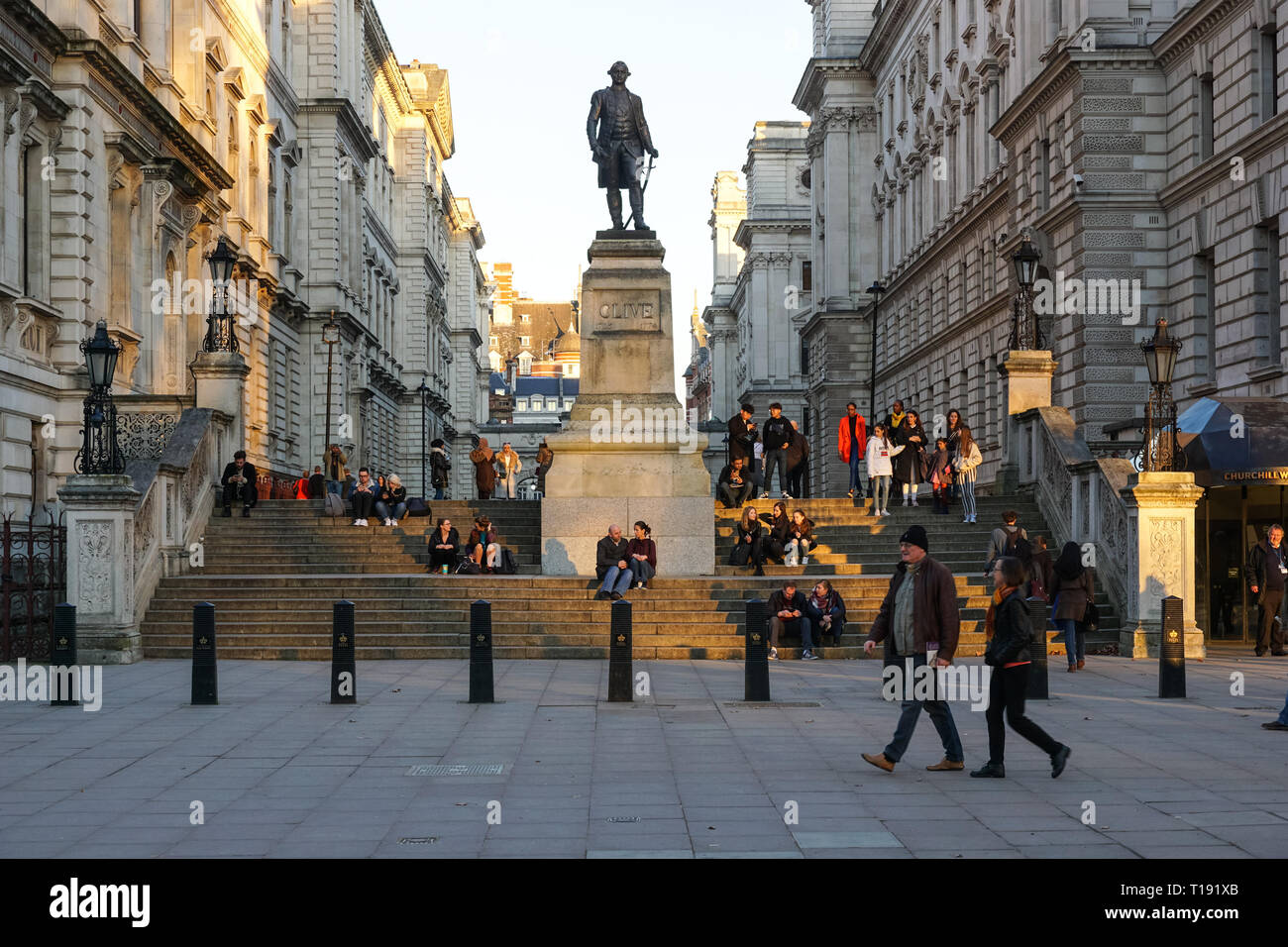 People enjoying sunset on Clive Steps with Robert Clive Memorial in the middle, London England United Kingdom UK Stock Photo
