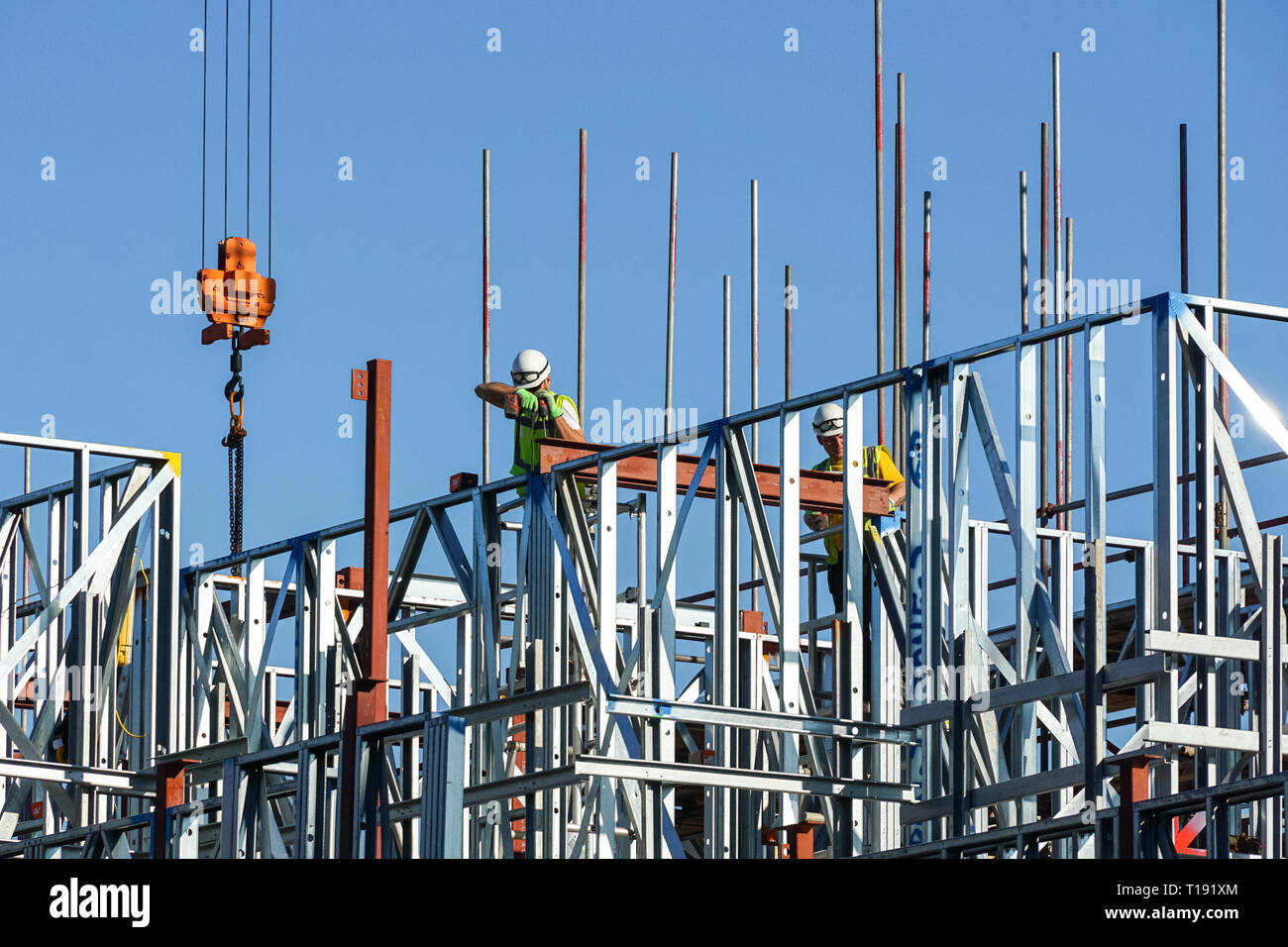 Builders working on construction site of residential building at Stratford, London England United Kingdom UK Stock Photo