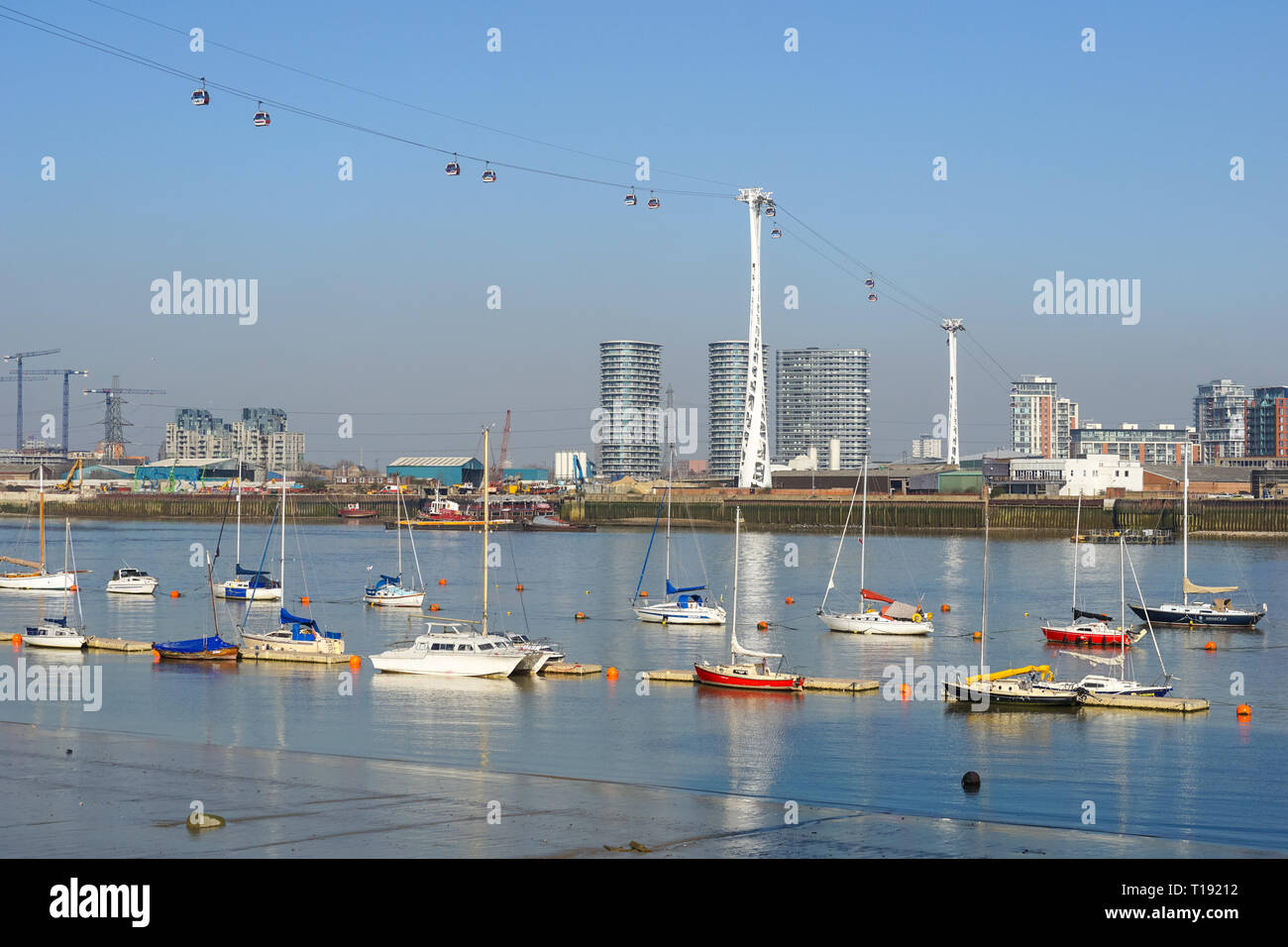 Yachts and boats on the River Thames with Emirates Air Line cable car