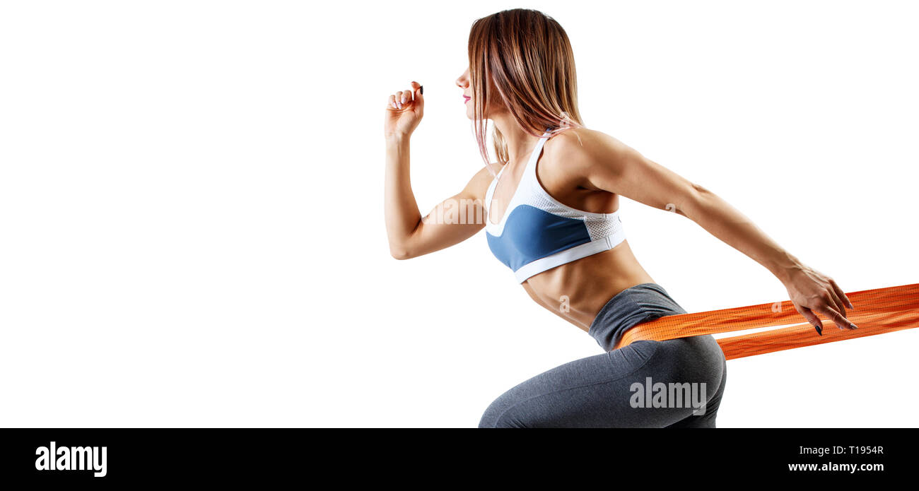 Young sporty woman using a resistance band. Stock Photo
