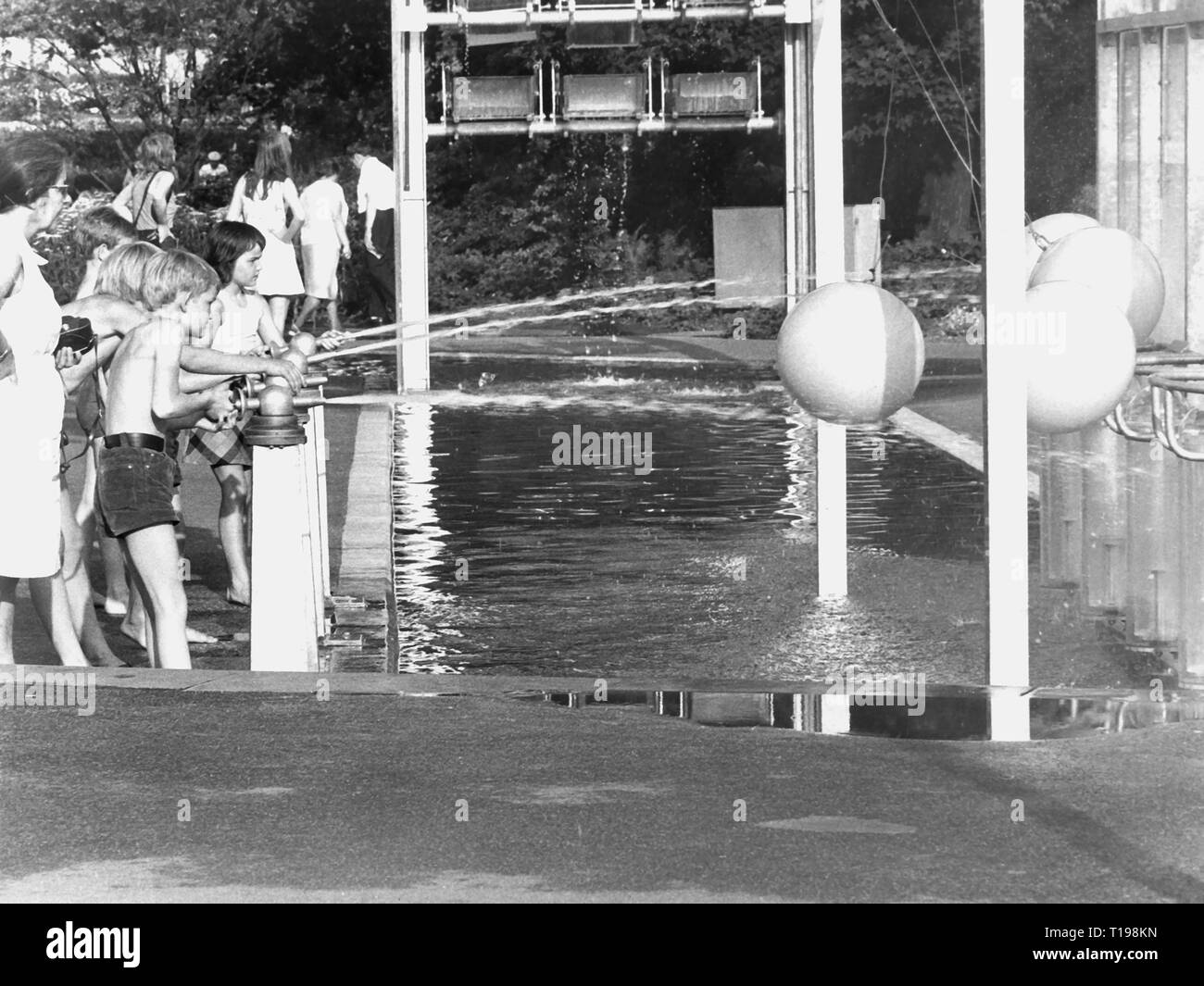 people, children, playing, children firing with water syringes on balls, international horticultural show, Hamburg, 1973, Additional-Rights-Clearance-Info-Not-Available Stock Photo