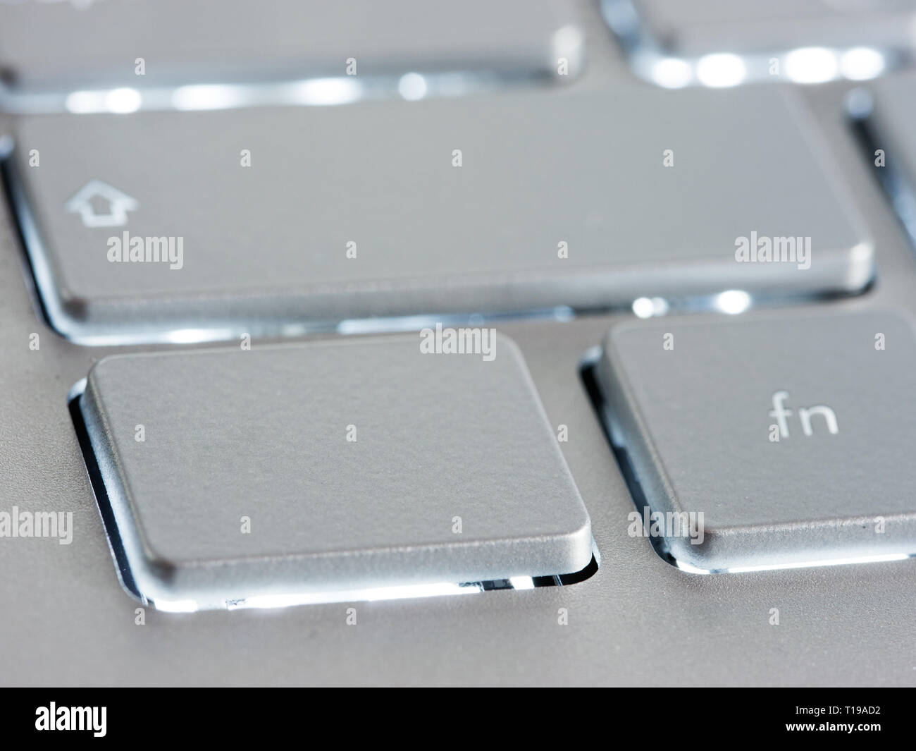 Blank silver button on laptop keyboard. Empty key button with copy space for message. Extreme close up Stock Photo