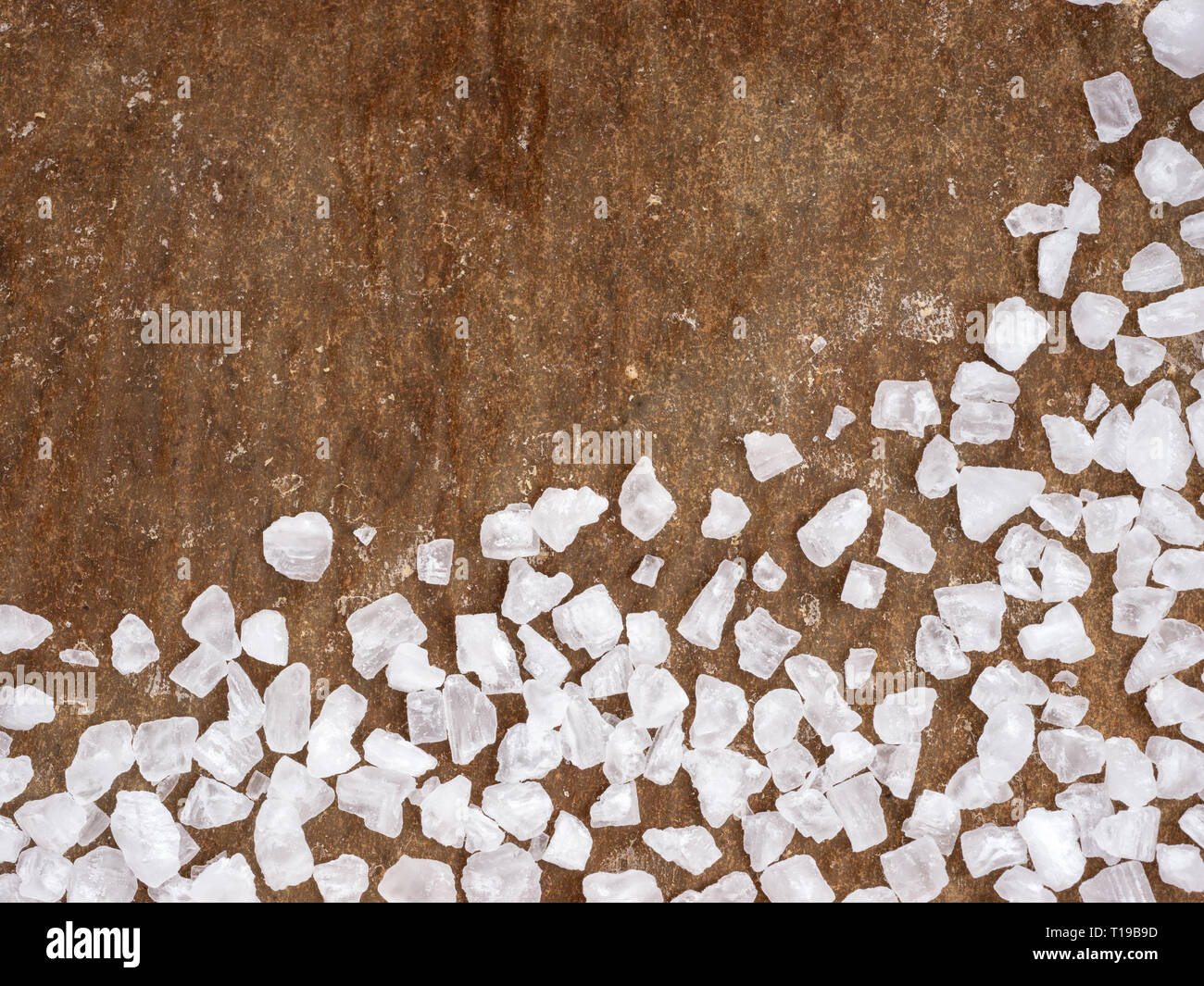 coarse salt closeup on baking parchment background with copy space. Top