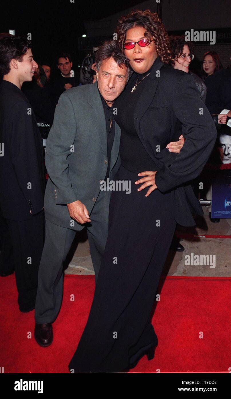 LOS ANGELES, CA - February 11, 1998: Actor DUSTIN HOFFMAN & actress QUEEN LATIFAH at premiere of their new movie, 'Sphere' in which they star with Sharon Stone & Samuel L. Jackson. Stock Photo