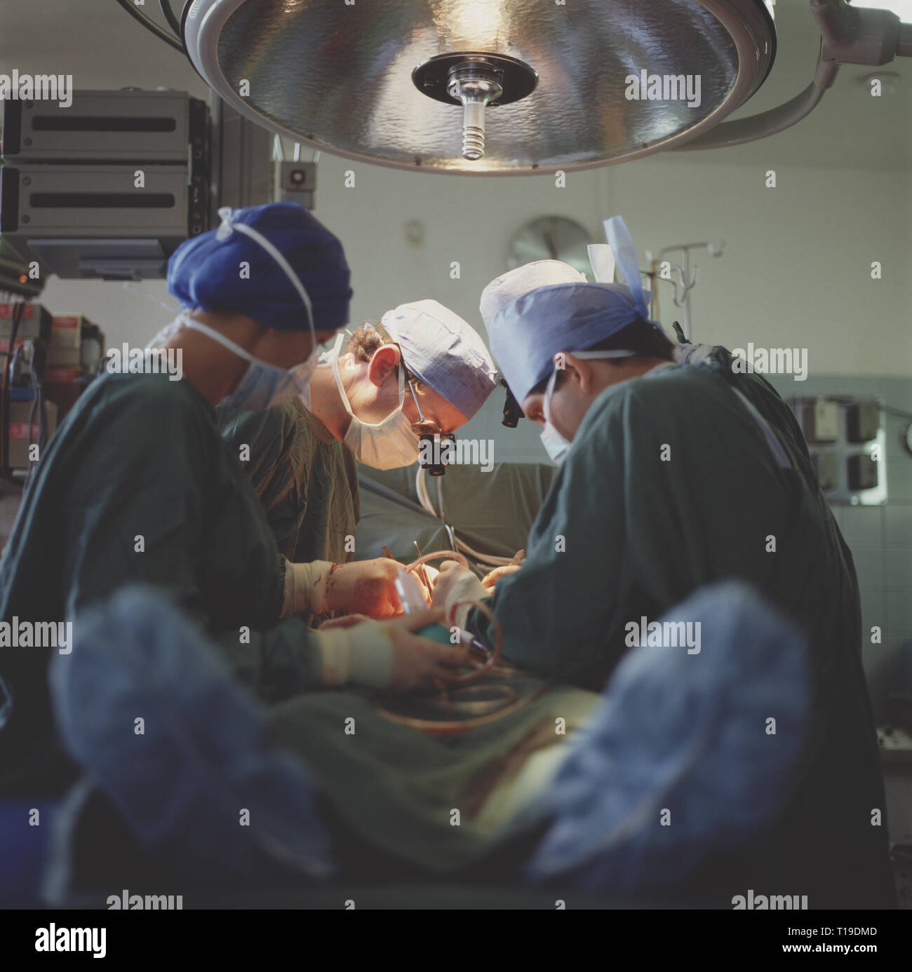 Medicine. Surgical team operating on patient. Stock Photo