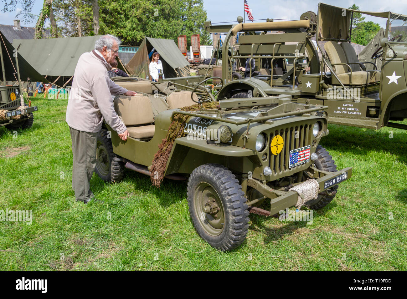 A Willys MB jeep, part of the D-Day 70th Anniversary events, re-enactors and vehicle displays in Sainte-Mère-Église, Normandy, France in June 2014. Stock Photo