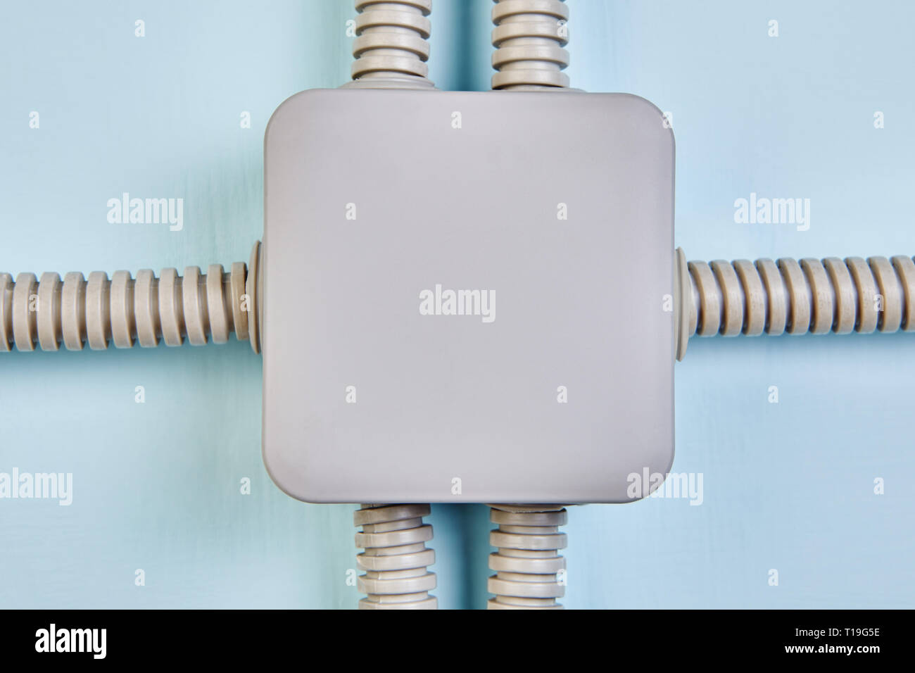 Electrical junction box after installation, electrical conduits