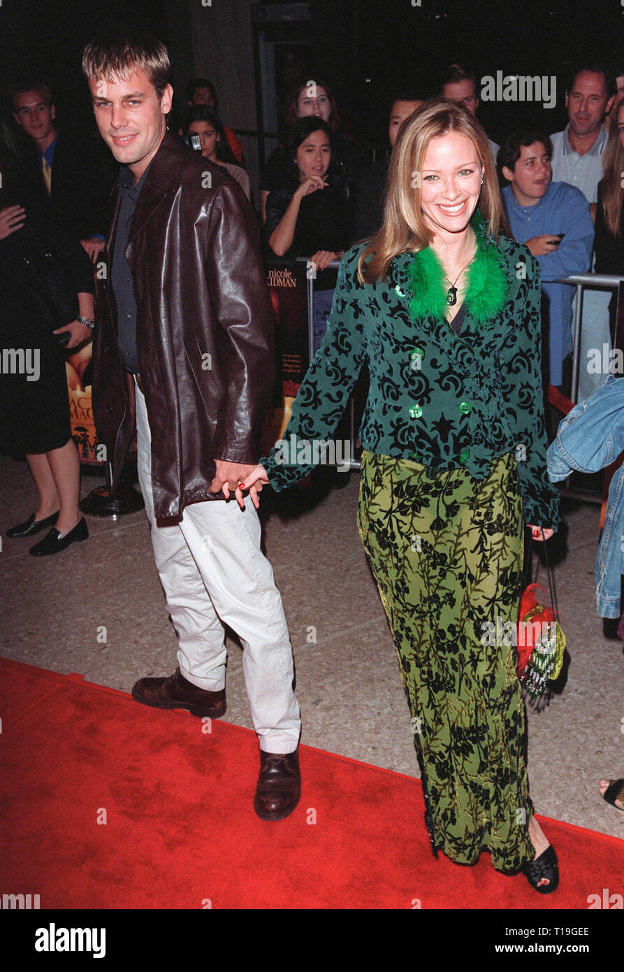LOS ANGELES, CA - October 13, 1998:  Actress LAUREN HOLLY & date at the Los Angeles premiere of  'Practical Magic' which stars Sandra Bullock, Nicole Kidman, Aidan Quinn & Stockard Channing. Stock Photo