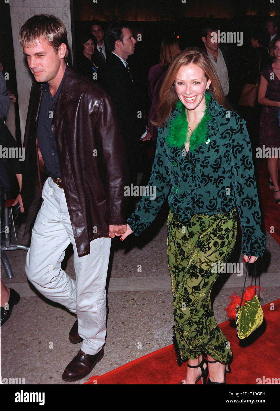 LOS ANGELES, CA - October 13, 1998:  Actress LAUREN HOLLY & date at the Los Angeles premiere of  'Practical Magic' which stars Sandra Bullock, Nicole Kidman, Aidan Quinn & Stockard Channing. Stock Photo