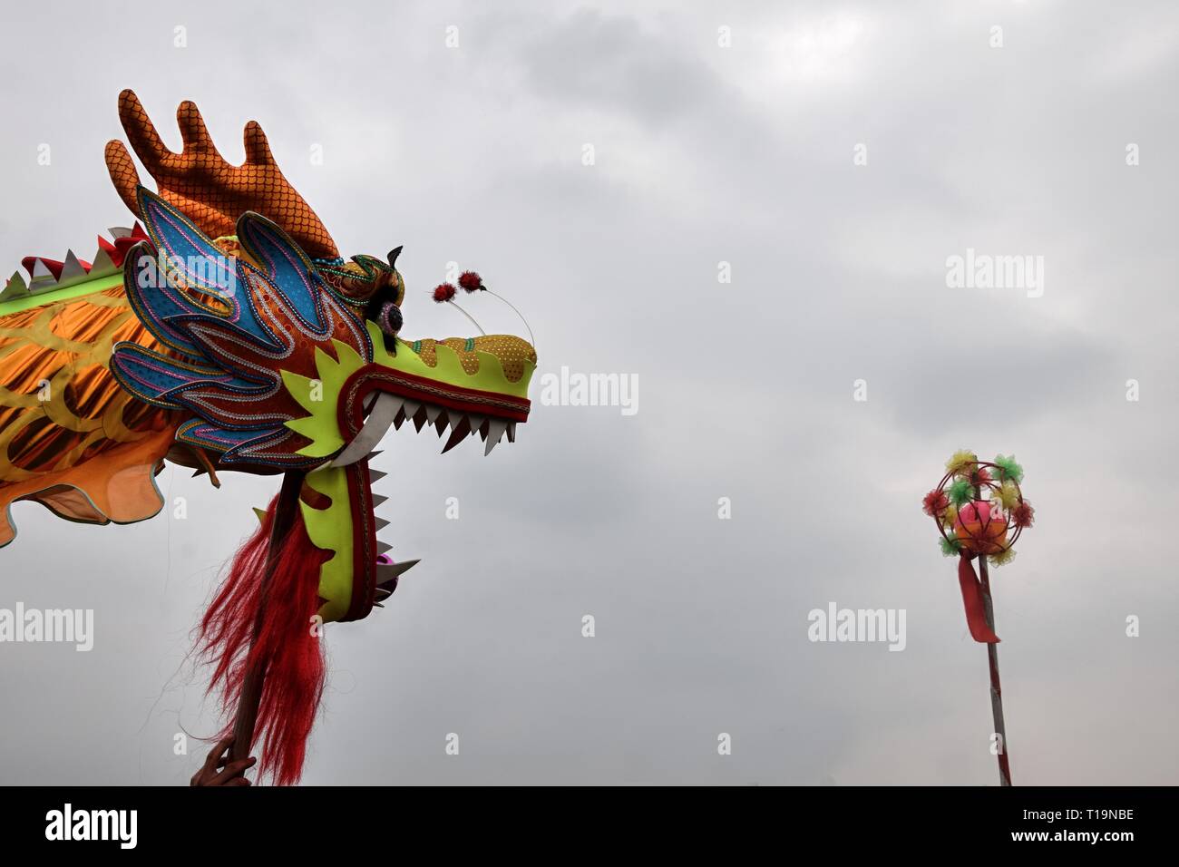 Dragon dance is a form of traditional dance in Chinese culture. It symbolizes the imagined movements of the river spirit in a sinuous manner. Stock Photo