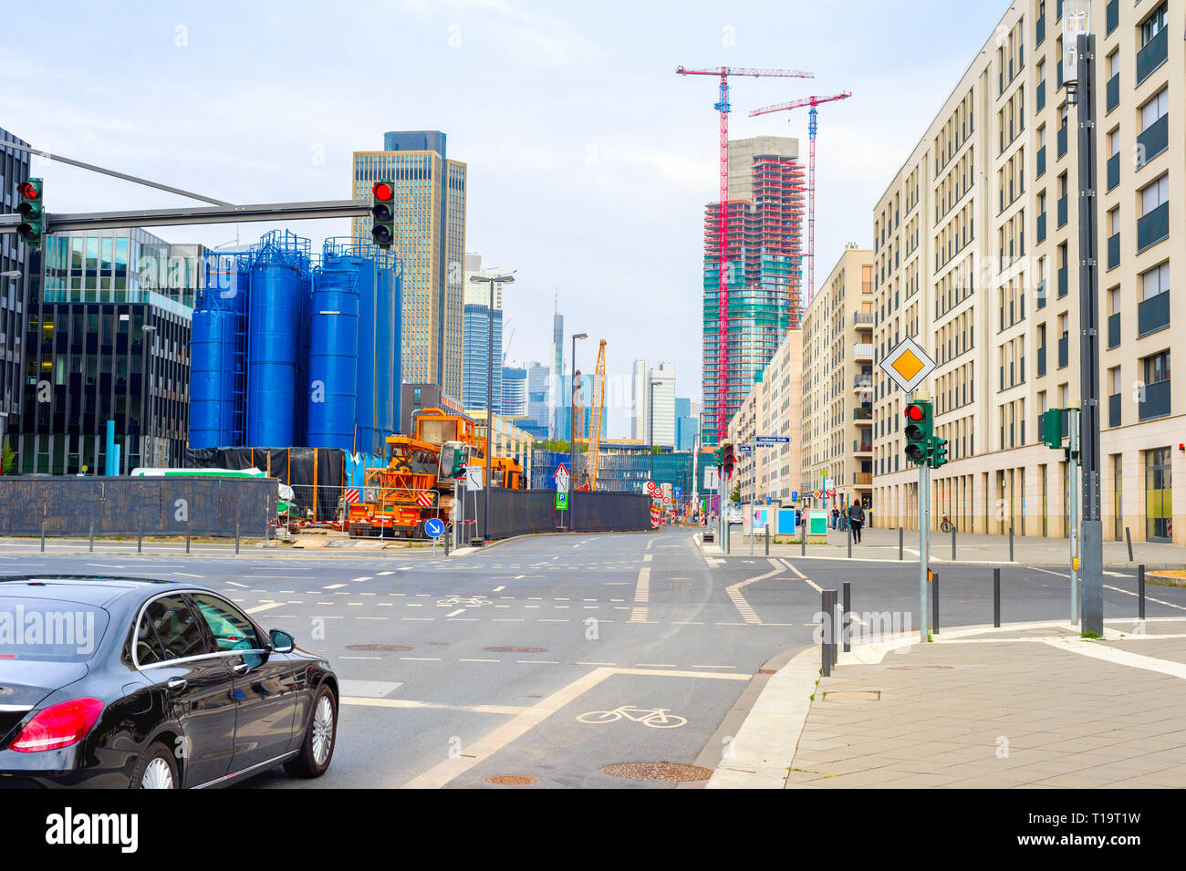 Frankfurt urban cityscape with car on crossroad, industrial plant ...