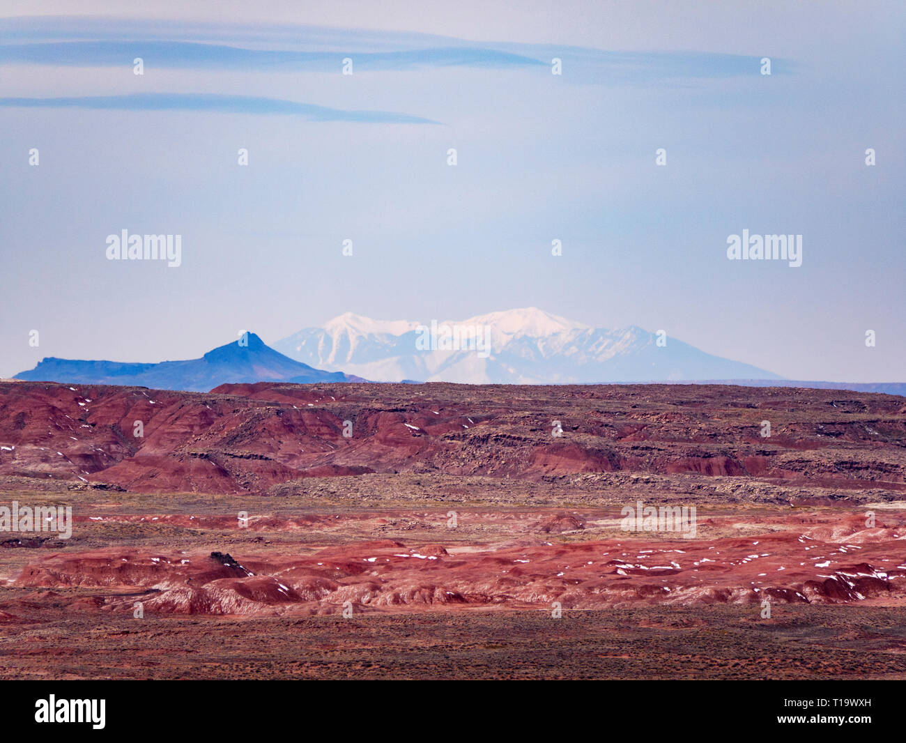 View of the Painted Desert from Pintado Point, Petrified Forest National Park. San Francisco Peaks on horizon over 100 miles away, base below horizon. Stock Photo