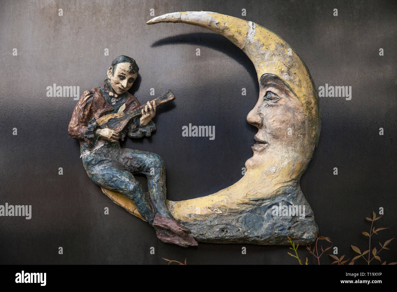 Sculpture of musician sitting on a crescent moon in Kyoto, Japan Stock Photo