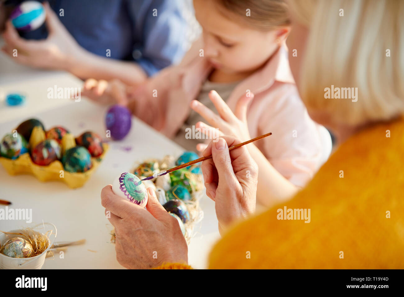 Woman Painting Easter Eggs Stock Photo