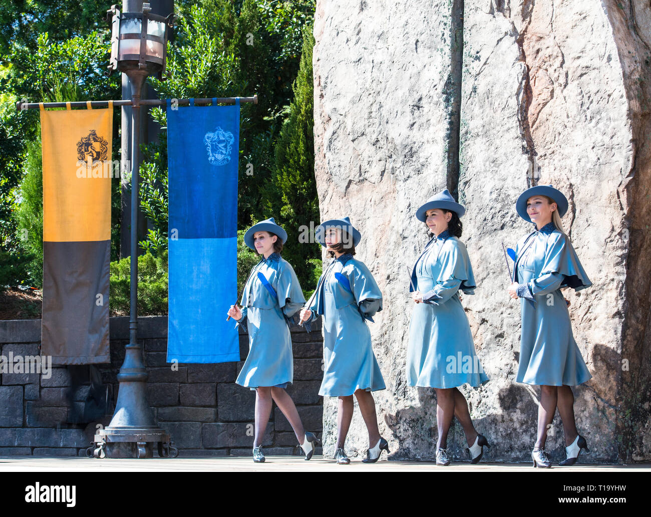 4 Beauxbatons female dancers, students onstage outdoors at the Wizarding World of Harry Potter in Orlando, Florida. Stock Photo