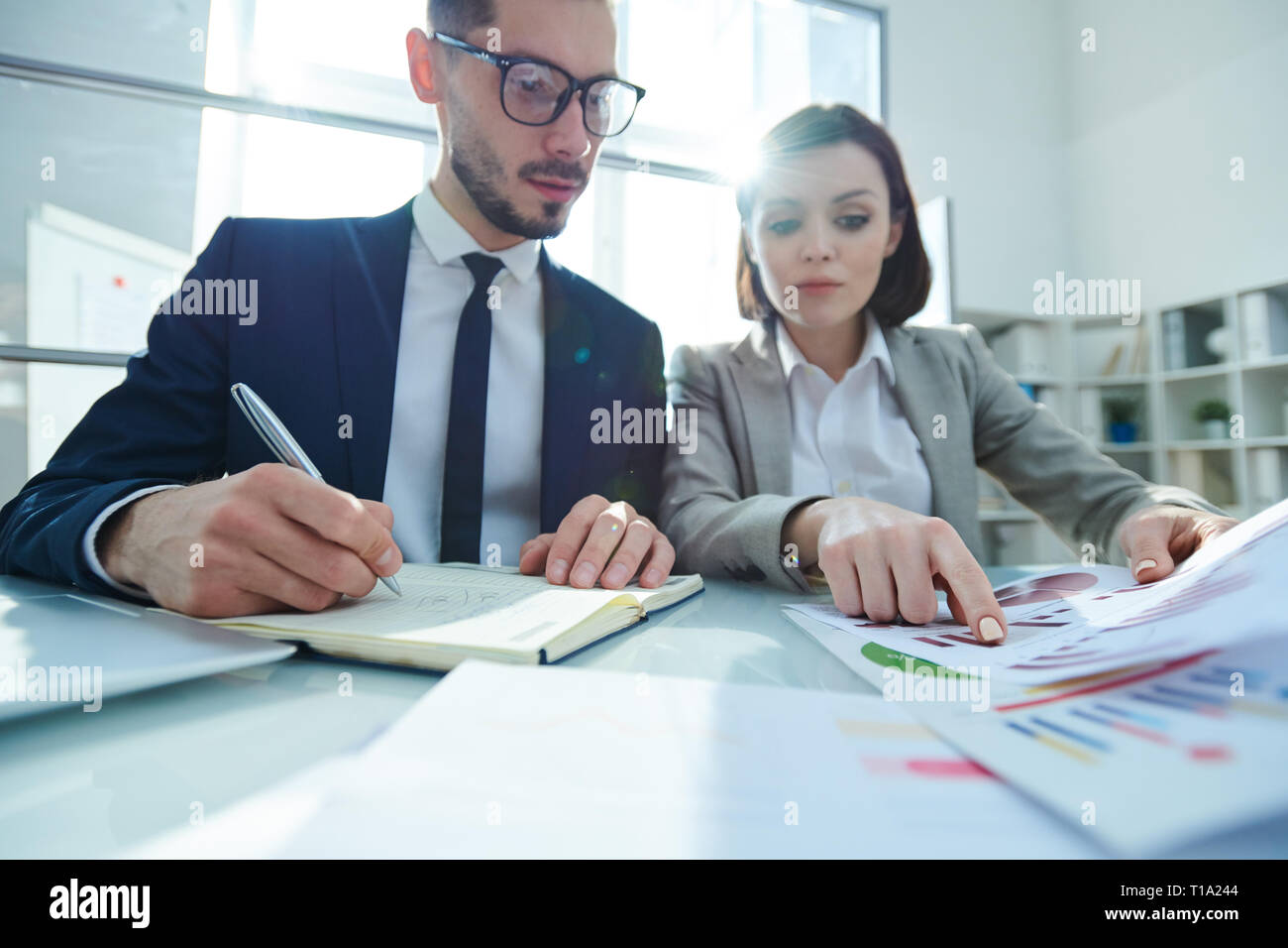 Two young confident analysts hi-res stock photography and images - Alamy