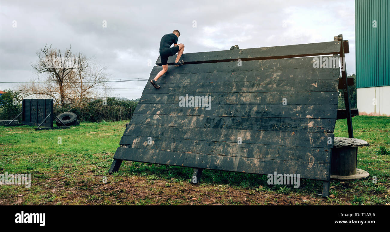 Inverted Pyramid Obstacle Course Participant in obstacle course climbing pyramid obstacle Stock Photo ...