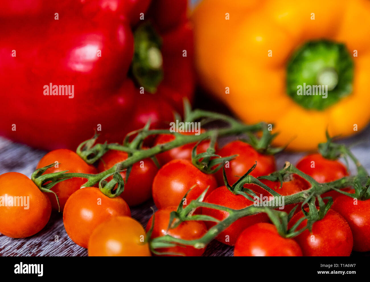 Download A Yellow And Red Pepper Capsicum And Cherry Tomatoes On The Vine Stock Photo Alamy Yellowimages Mockups
