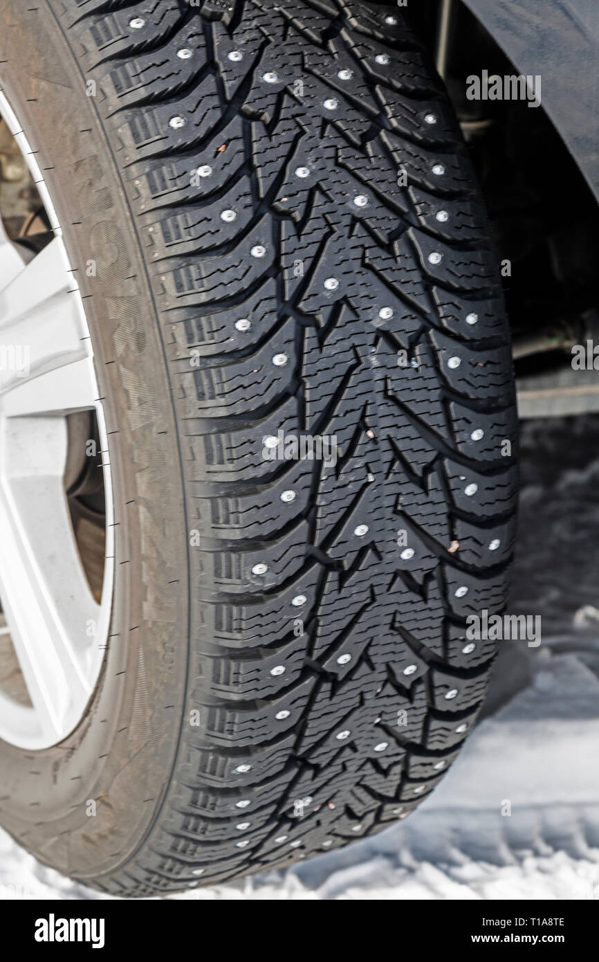 A studded car tyre, or tire, designed for use on icey roads in the winter. Stock Photo