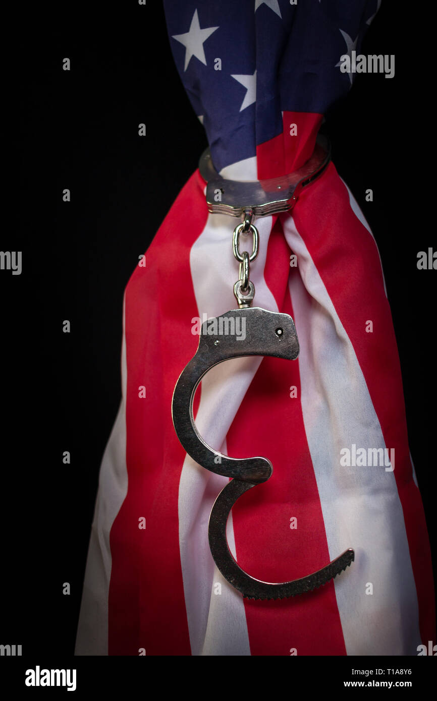 Handcuffs on an American Flag Stock Photo