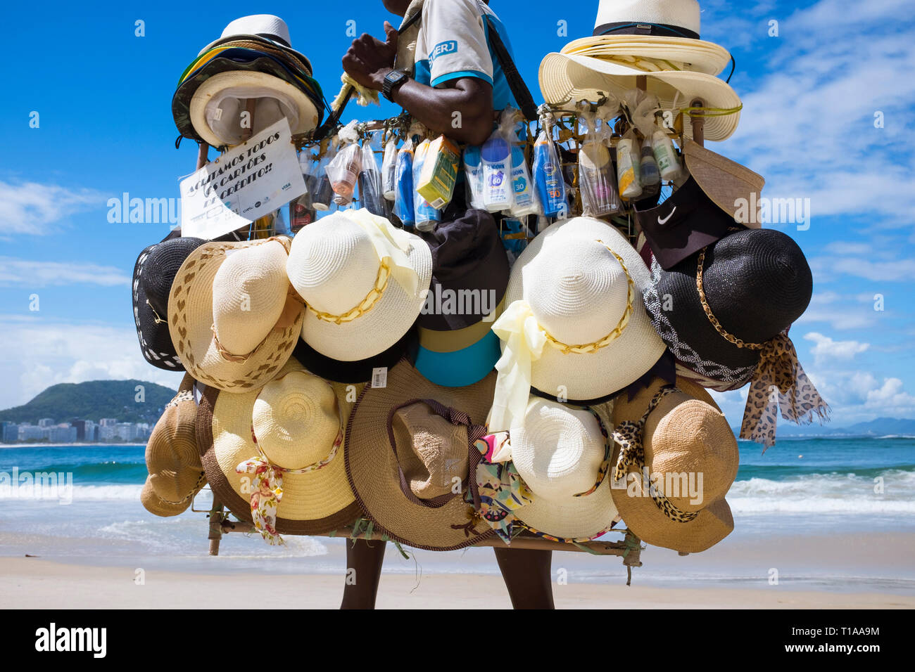 Selling beach hats hi-res stock photography and images - Alamy