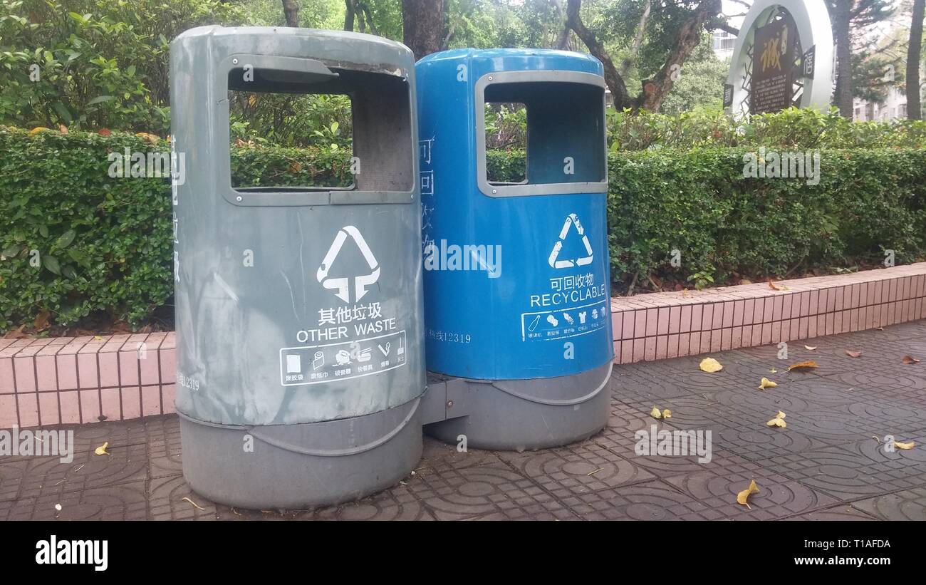Garbage sorting bins are placed in streets or parks to facilitate people to put garbage. Stock Photo