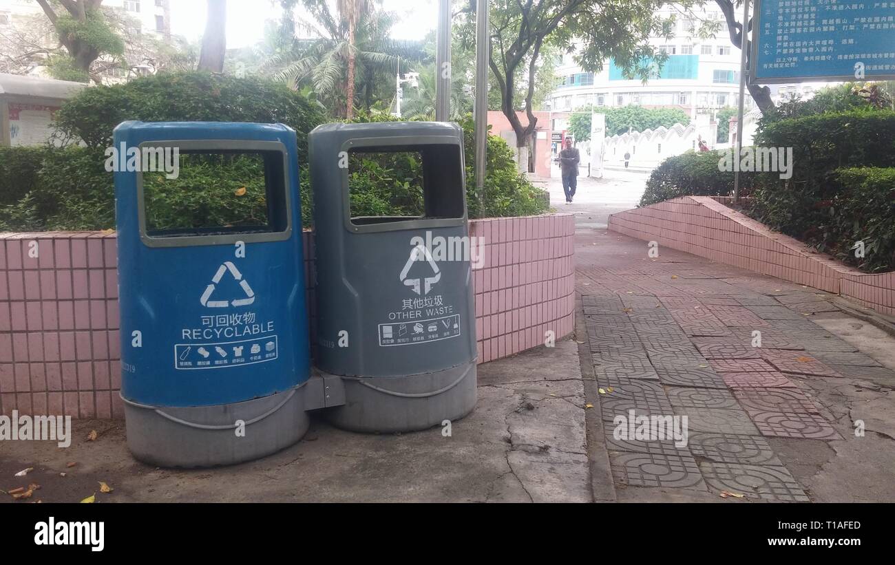 Garbage sorting bins are placed in streets or parks to facilitate