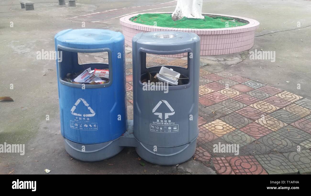 Garbage sorting bins are placed in streets or parks to facilitate