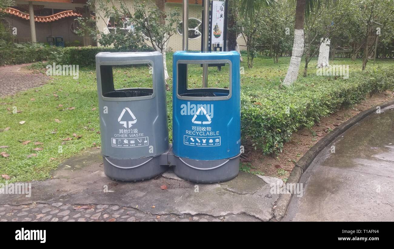 Garbage sorting bins are placed in streets or parks to facilitate