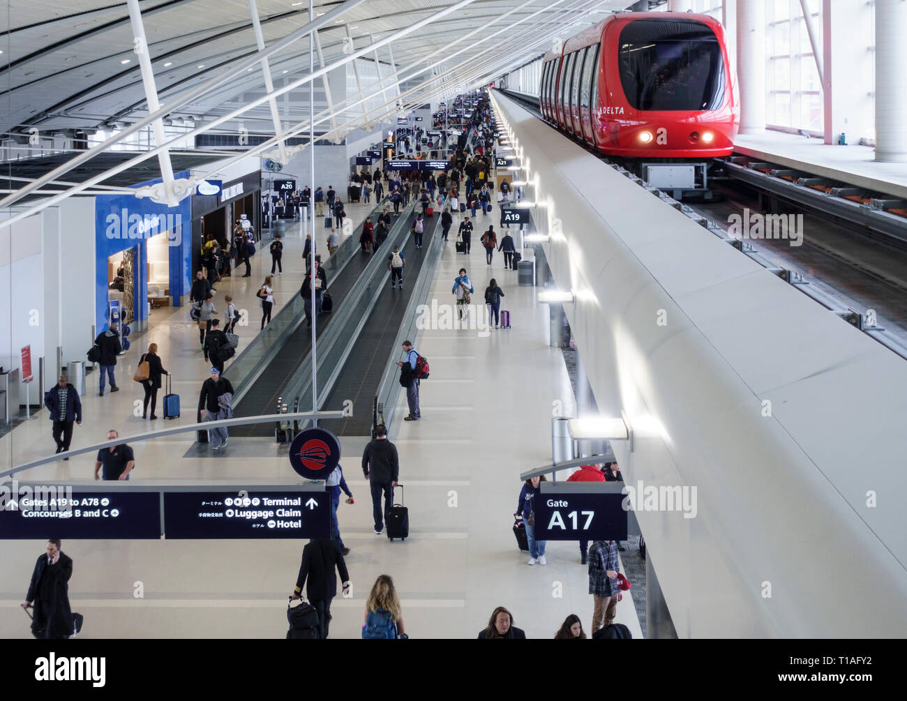 People travelers in Delta Airlines airport terminal, Detroit, Michigan, United States Stock Photo