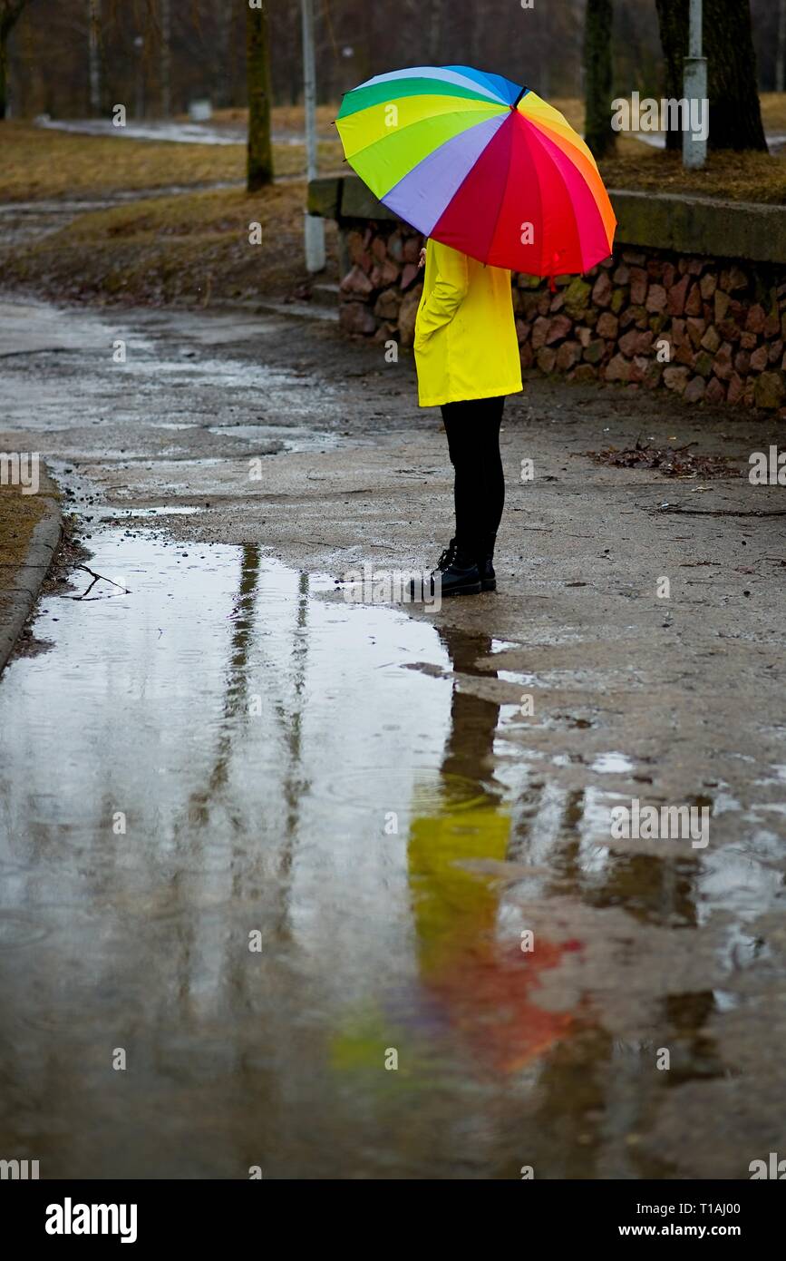 young woman with colorful umbrella, positive thinking Stock Photo