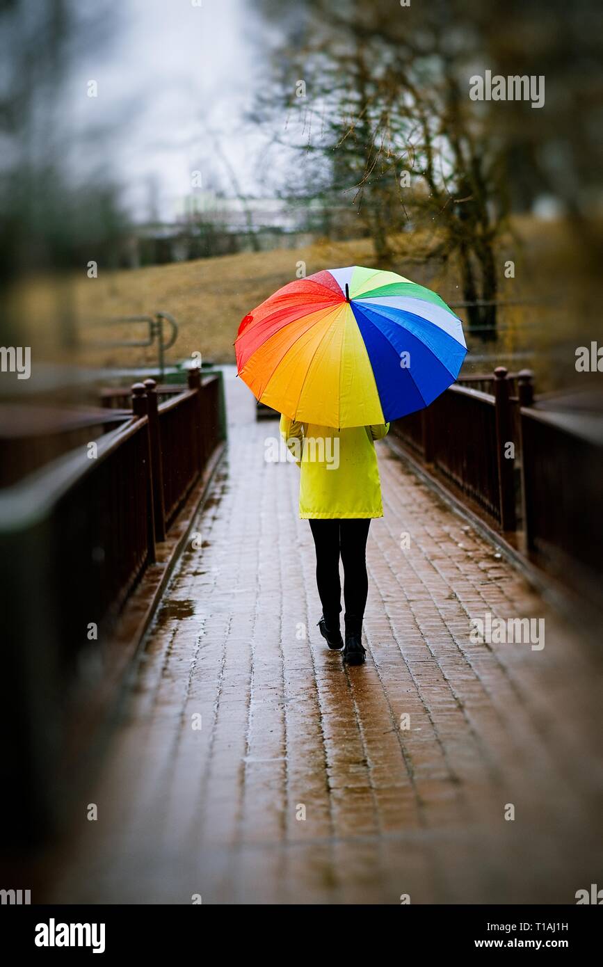 young woman with colorful umbrella, positive thinking Stock Photo