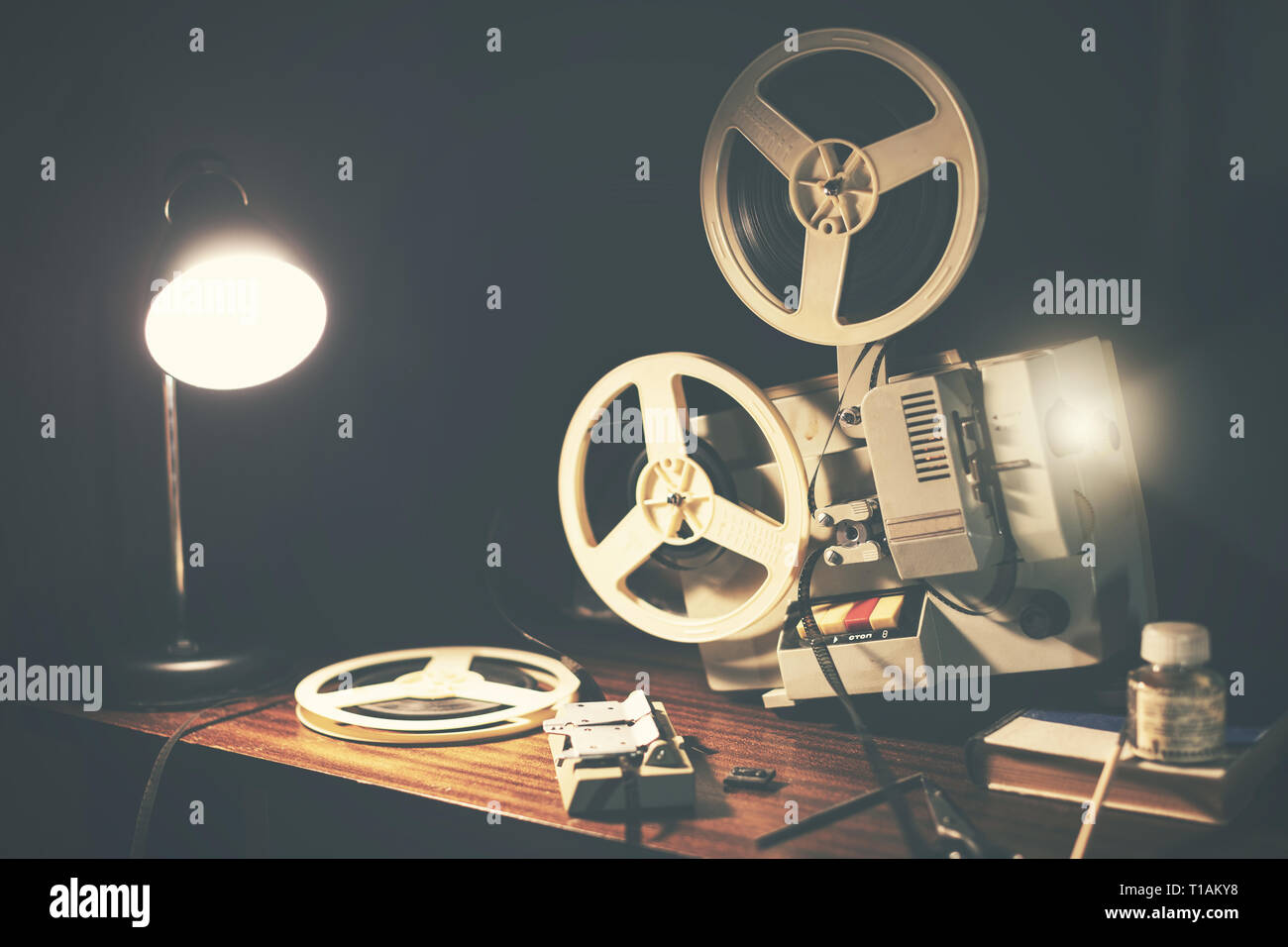 retro 8mm movie projector on the table Stock Photo