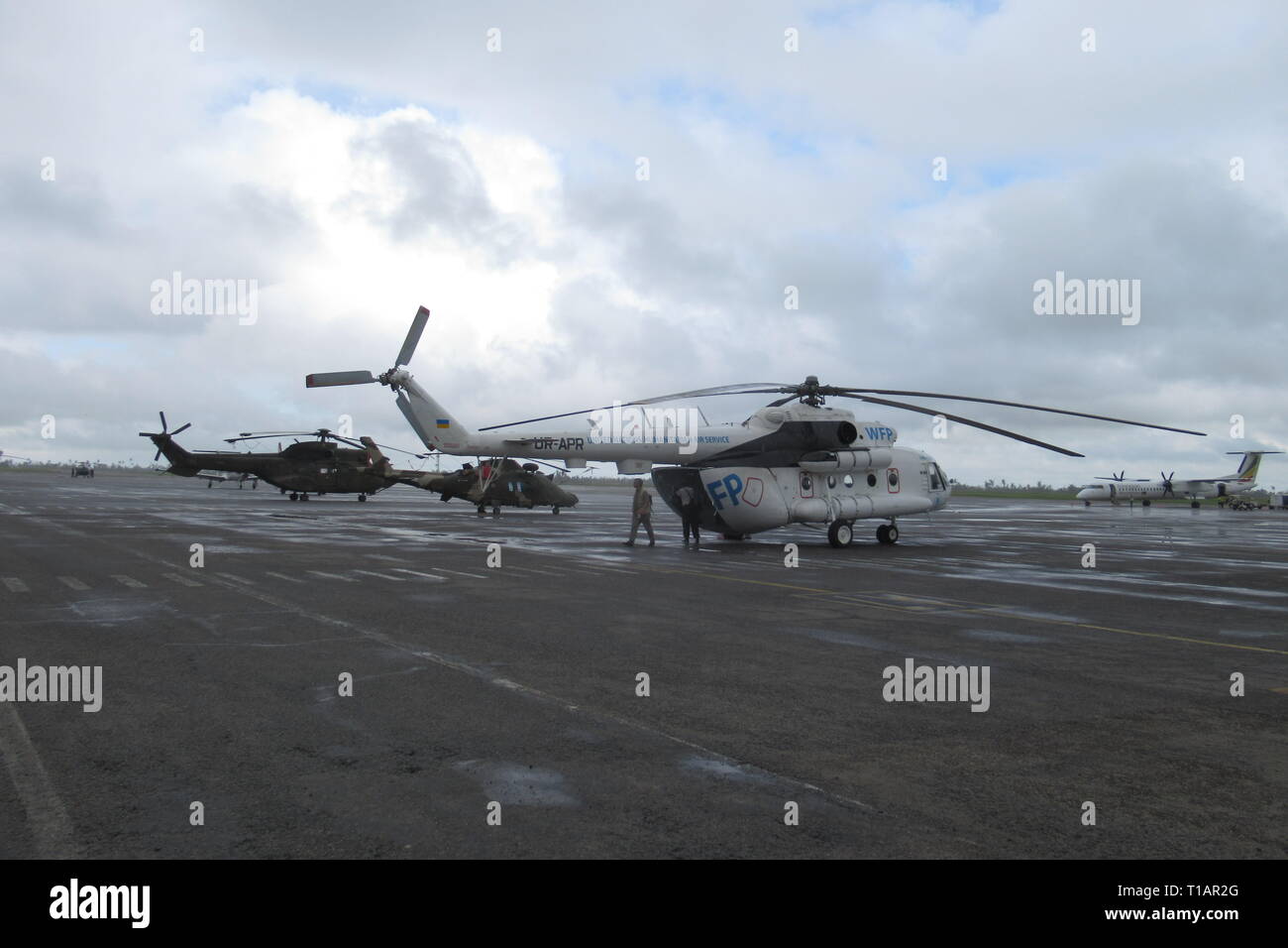 Beira, Mozambique. 21st Mar, 2019. Rescue helicopters are standing at Beira airport. (to dpa 'Helpers in Mozambique warn against diseases after cyclone' from 25.03.2019) Credit: Kate Bartlett/dpa/Alamy Live News Stock Photo