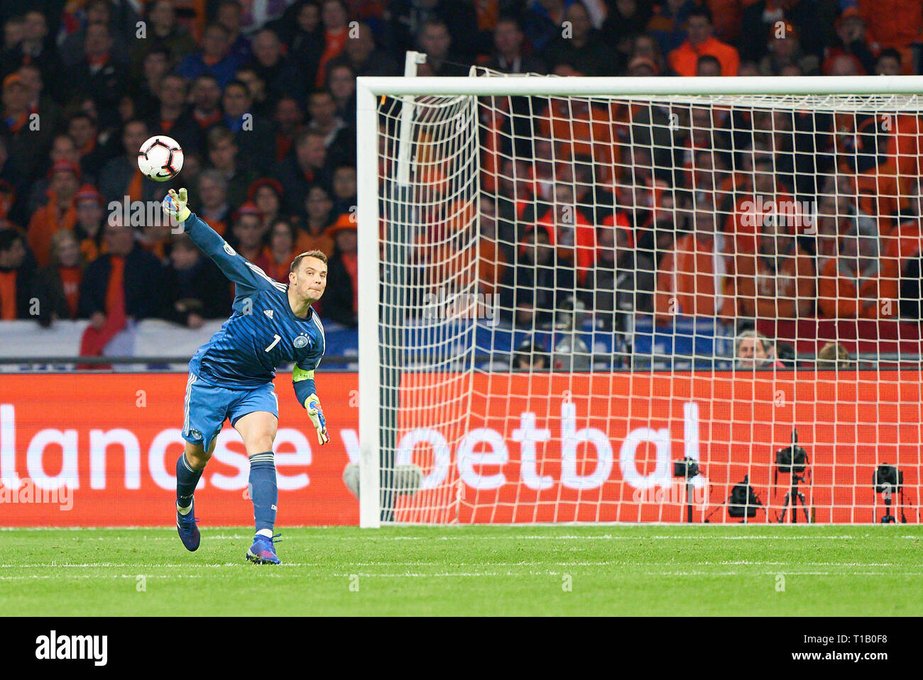 Amsterdam, Netherlands. 24th Mar, 2019. Manuel NEUER, DFB 1 goalkeeper, drives, controls the ball, action, full-size, Single action, einzelaktion, with ball, full body, whole figure, cutout, single shots, ball treatment, pick-up, header, cut out, einzelaktion, through, NETHERLANDS - GERMANY 2-3 Important: DFB regulations prohibit any use of photographs as image sequences and/or quasi-video. Qualification for European Championships, EM Quali, 2020 Season 2018/2019, March 24, 2019 in Amsterdam, Netherlands. Credit: Peter Schatz/Alamy Live News Stock Photo
