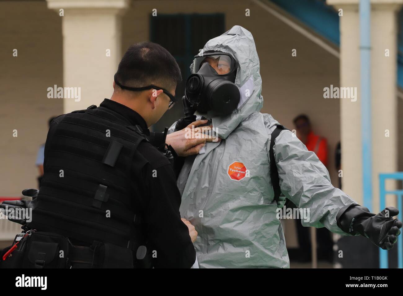 Hong Kong. 25th Mar, 2019. SDU officer is helped by his colleague to ...