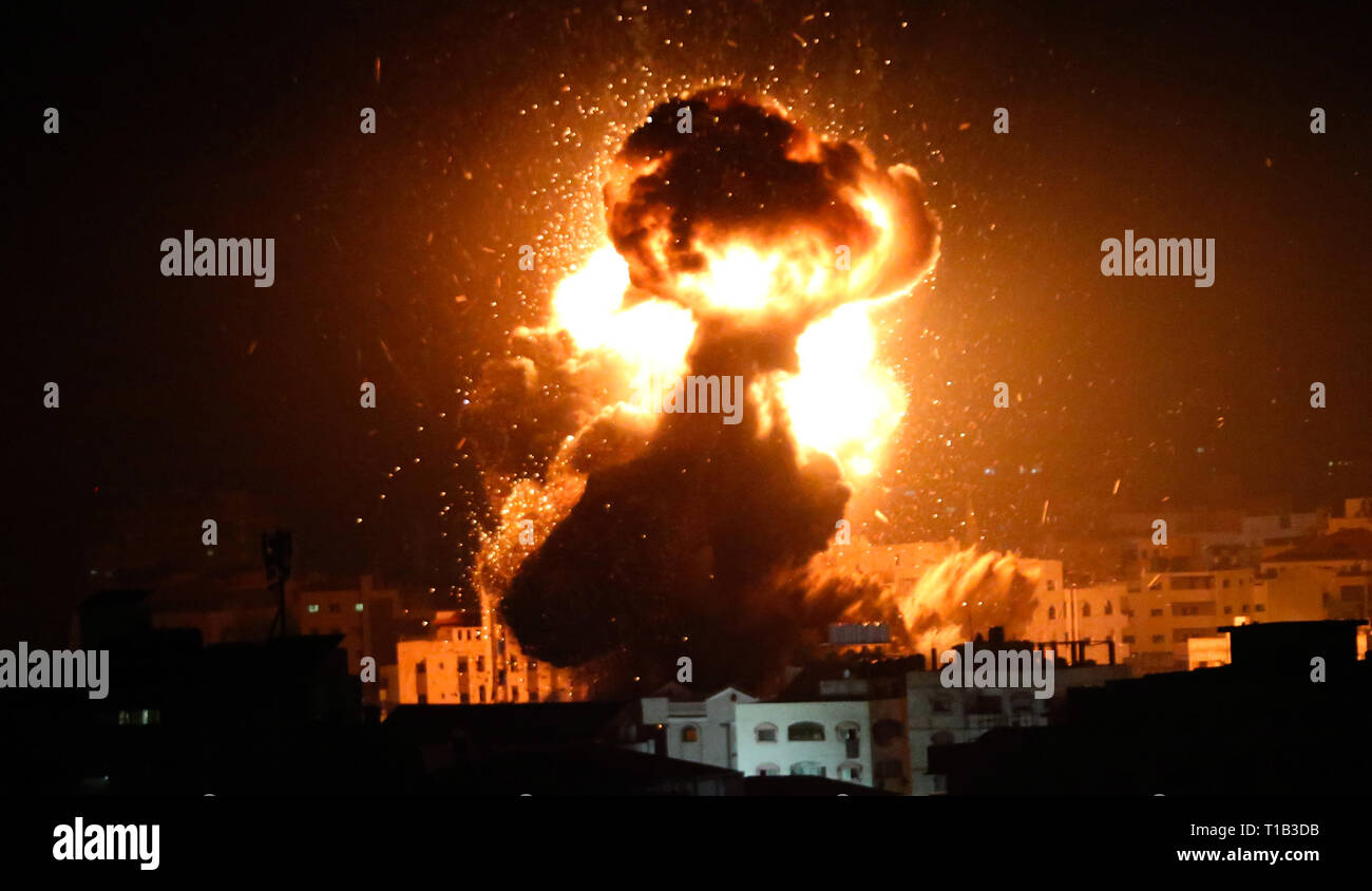 Gaza City, Gaza Strip, Palestinian Territory. 25th Mar, 2019. A ball of fire is seen following an Israeli air strike on building believed to house the offices of Hamas chief in Gaza, Ismail Haniyeh, during Israeli strikes on the Gaza City, March 25, 2019. Israel launched air strikes in the Gaza Strip on Monday after a rocket attack near Tel Aviv wounded seven people, prompting Prime Minister Benjamin Netanyahu to cut short a visit to the United States Credit: Ashraf Amra/APA Images/ZUMA Wire/Alamy Live News Stock Photo